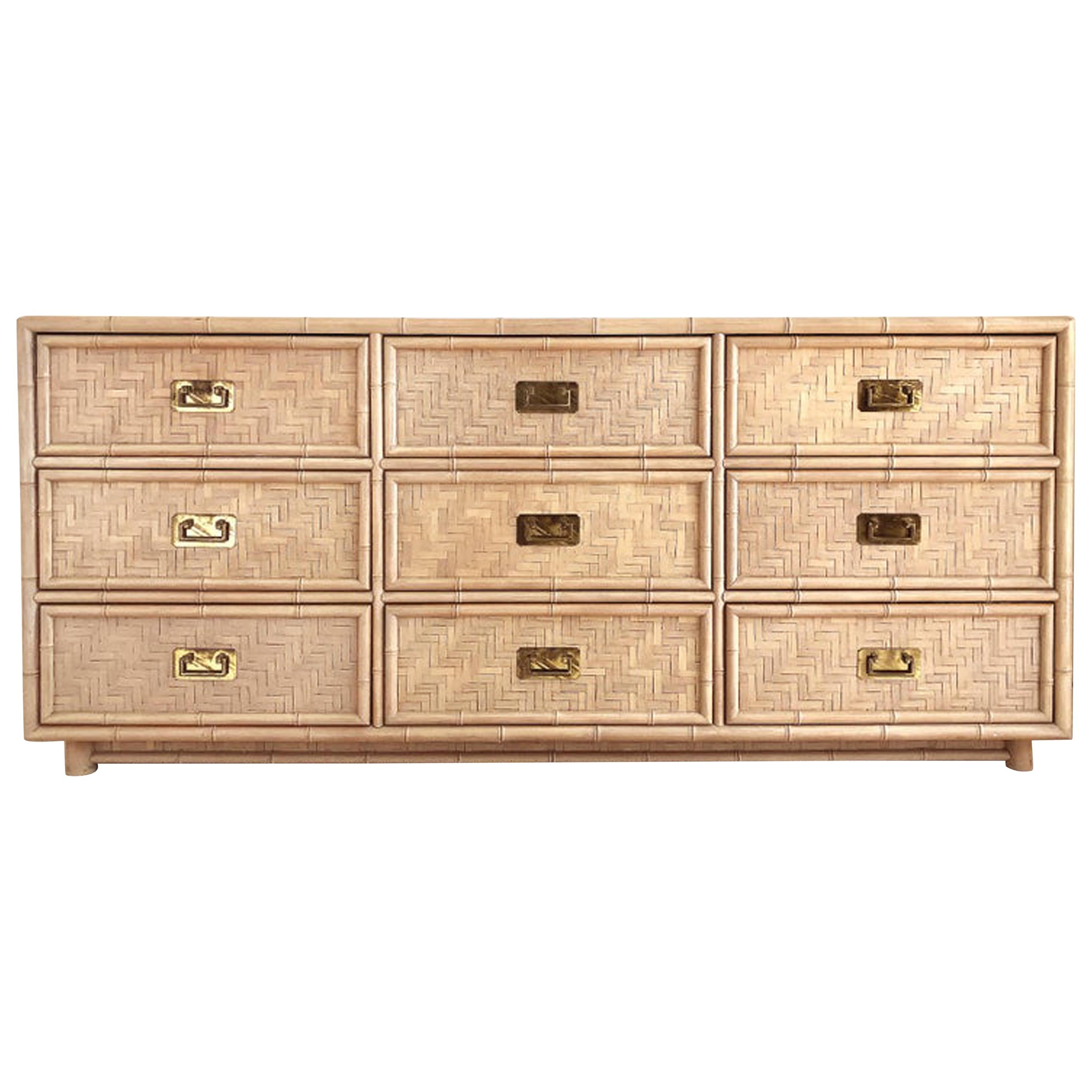 Costal midcentury woven rattan 9-drawer dresser

Offered for sale is a 1970s vintage coastal modern woven rattan 9-drawer dresser. The dresser has a wood frame with woven split rattan and brass hardware. It has been finished in a soft pink