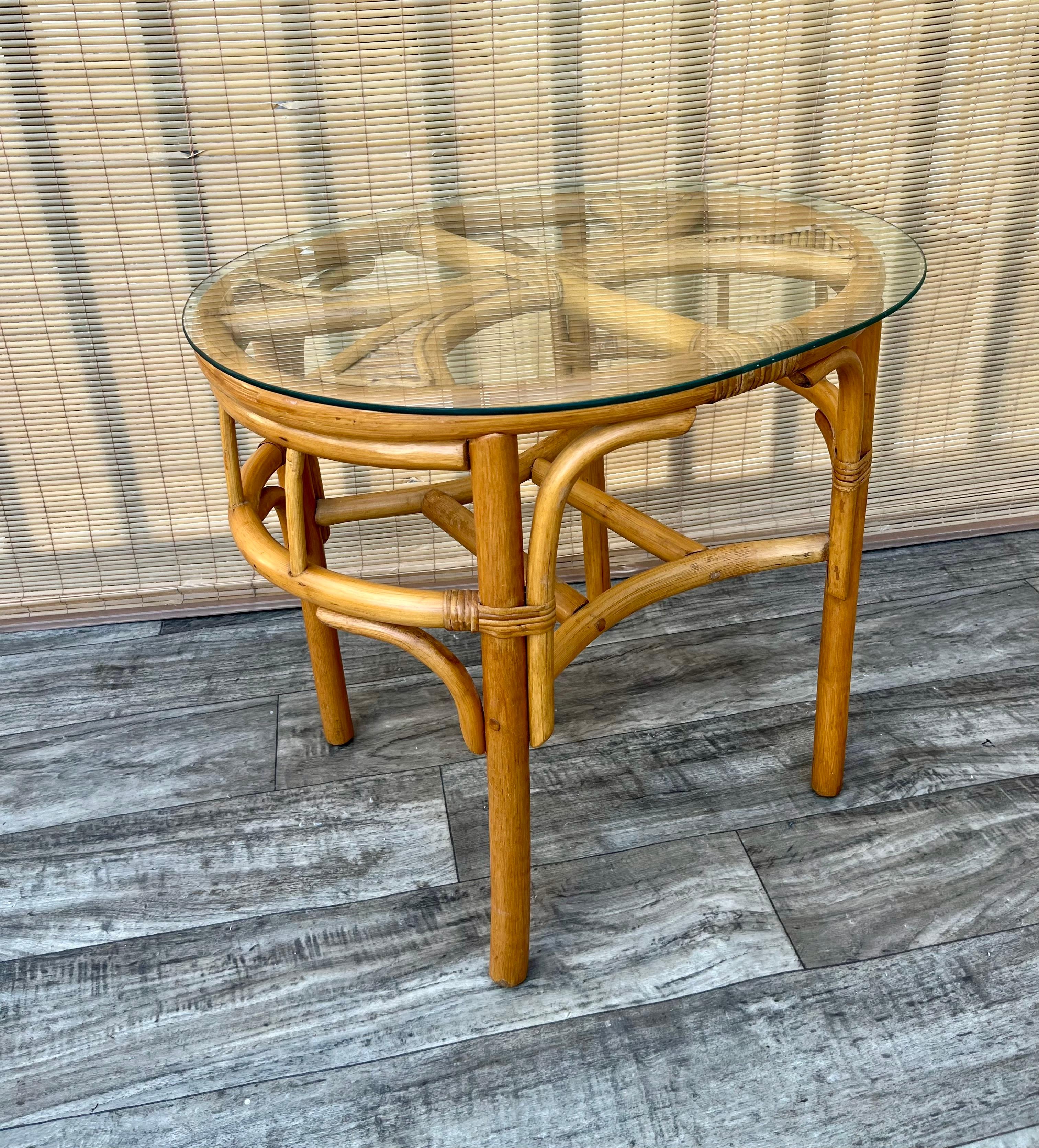 Vintage Costal Style/ Bohemian Split Bamboo and Rattan Boho Side Table. Circa 1980s
Features a sculpted rattan and split bamboo frame with oval shaped edges and a removable glass top. 
In excellent Original Condition with minor signs of wear and