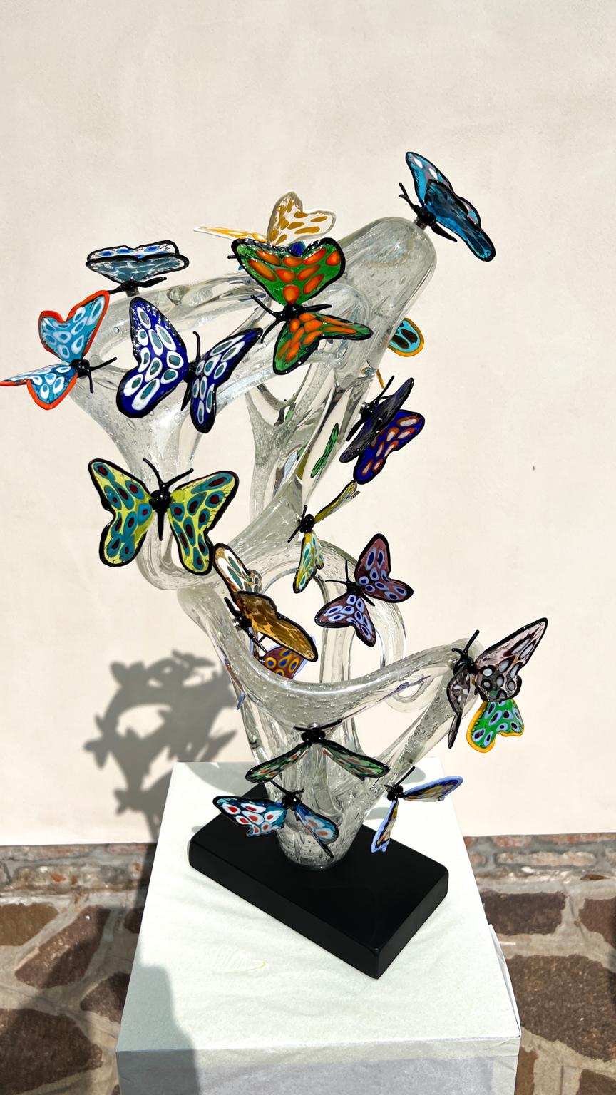 Handmade Crystal Pulegoso Murano Glass Sculpture Infinity with 21 transparent multicolored butterflies attached with magnet. 
Modern sculpture ideal for a modern and rustic classic environment, for everyone. This work was carried out in