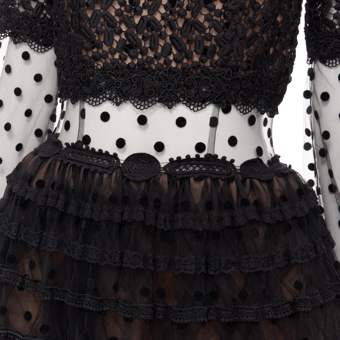 COSTARELLOS black polka dot devore embroidery trim tulle gown dress FR38 M
Reference: KEDG/A00227
Brand: Costarellos
Material: Polyester, Blend
Color: Black, Nude
Pattern: Polka Dot
Closure: Zip
Lining:  Unlined
Extra Details: Sheer bodice. Lined