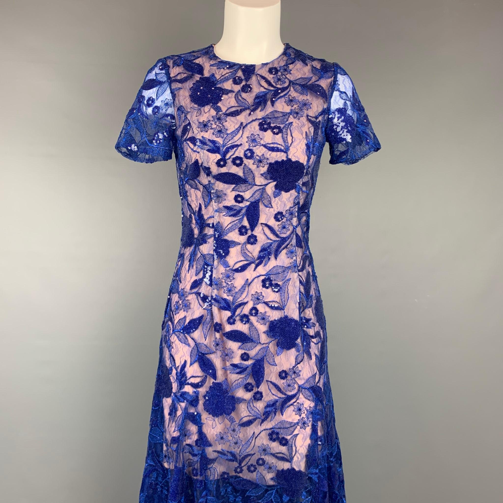 COSTARELLOS cocktail dress comes in a blue sequin polyester / nylon with a nude slip liner featuring an a-line style, short sleeves, embroidered designs, and a back zip up closure. 

Very Good Pre-Owned Condition.
Marked: