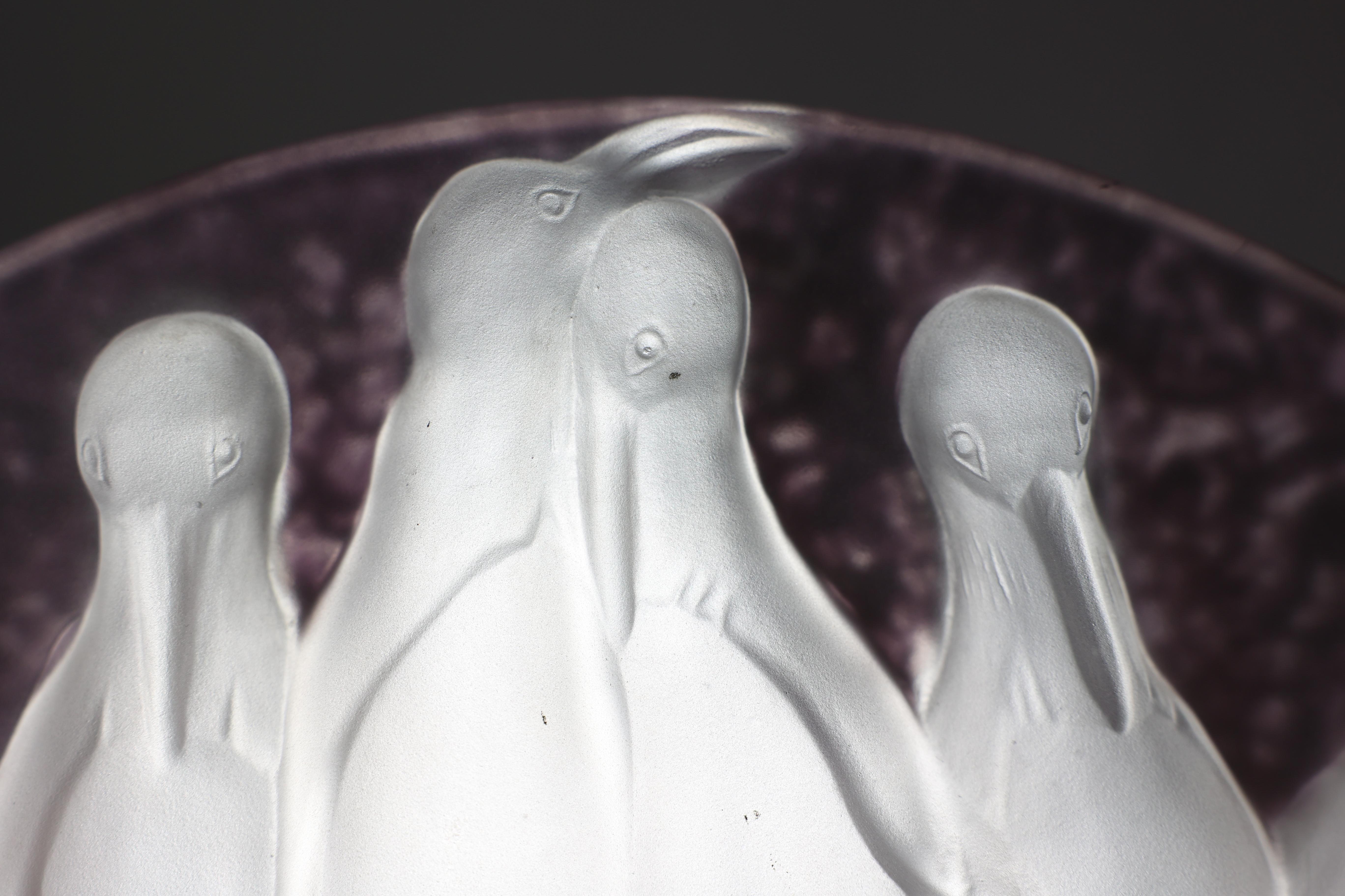 Mid-20th Century Costebelle. An Art Deco frosted opalescent half-moon glasswork with penguins