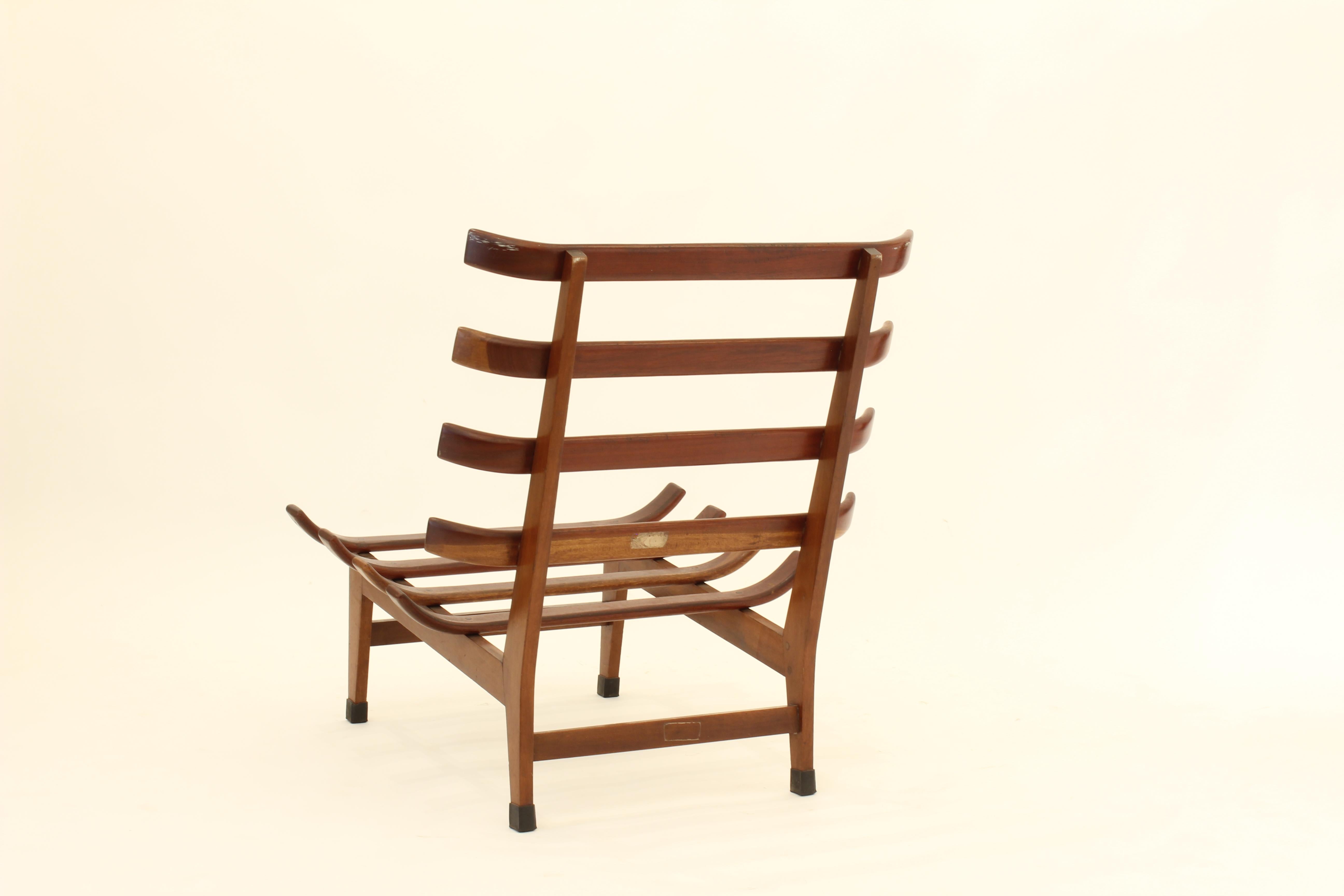 Vintage Brazilian Costela chair, a very popular design mimicking ribs of which Costello means in Portuguese. Has the original label attached. 