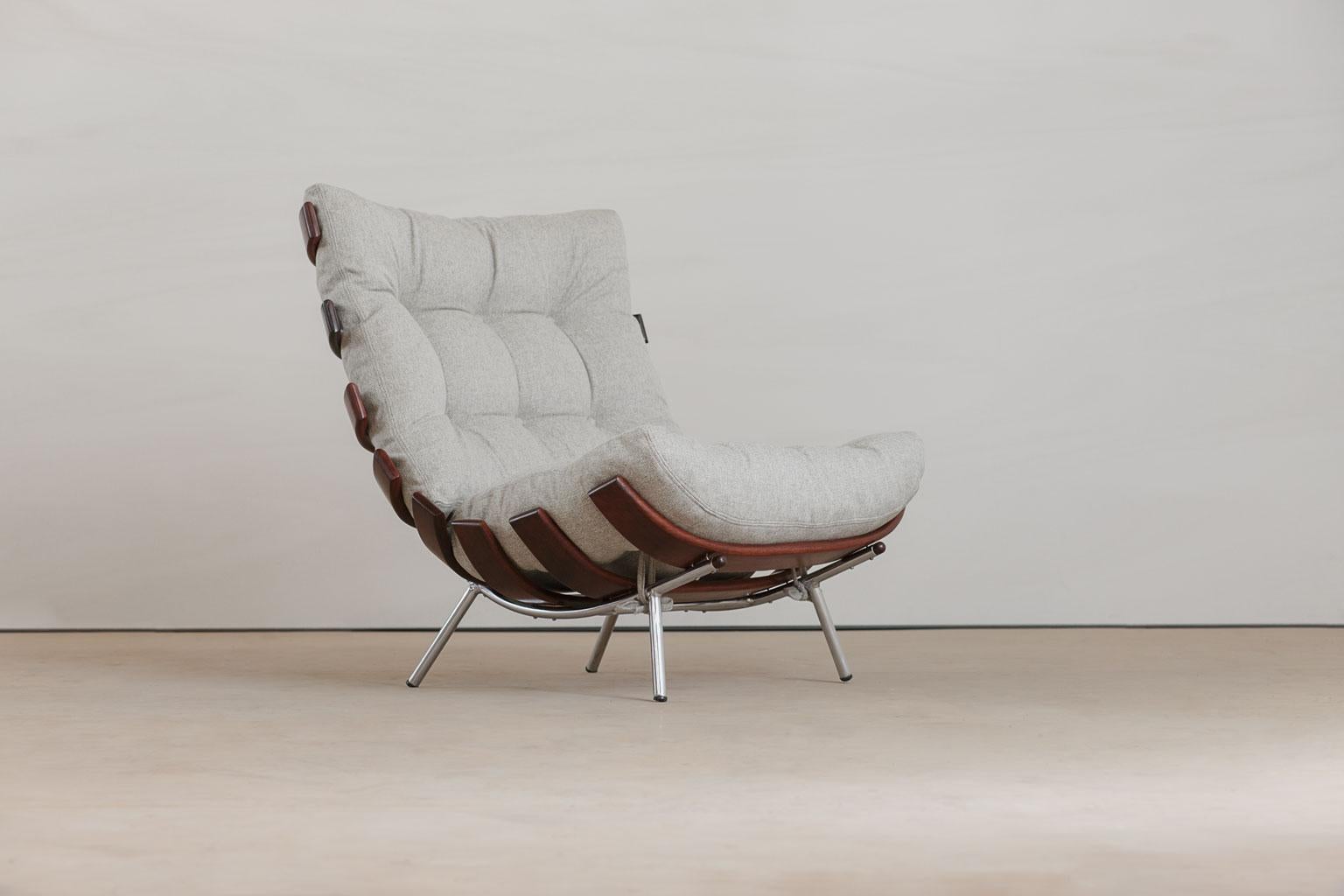 Rib chair (also called Costela chair) designed by Martin Eisler and Carlo Hauner in Brazilian Imbuia wood and chrome structure. These chairs are iconic Brazilian Mid-Century Modern pieces, circa 1950. The chair has been recently reupholstered in off