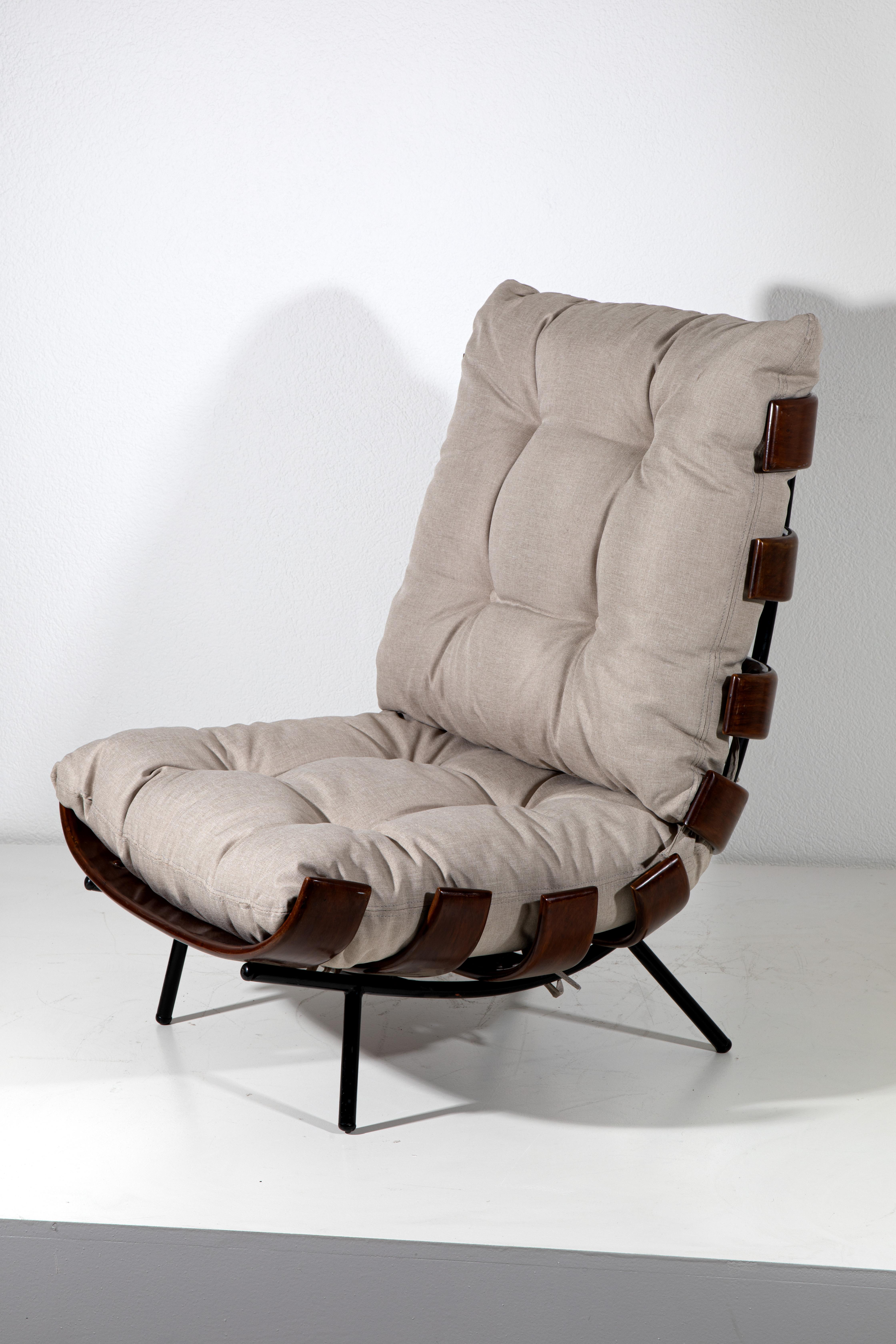 Introduce a touch of mid-century sophistication to your space with the iconic Costela Lounge Chair, originally designed by Carlo Hauner and Martin Eisler. Crafted in the 1950s, this chair combines innovative design with supreme comfort, making it a