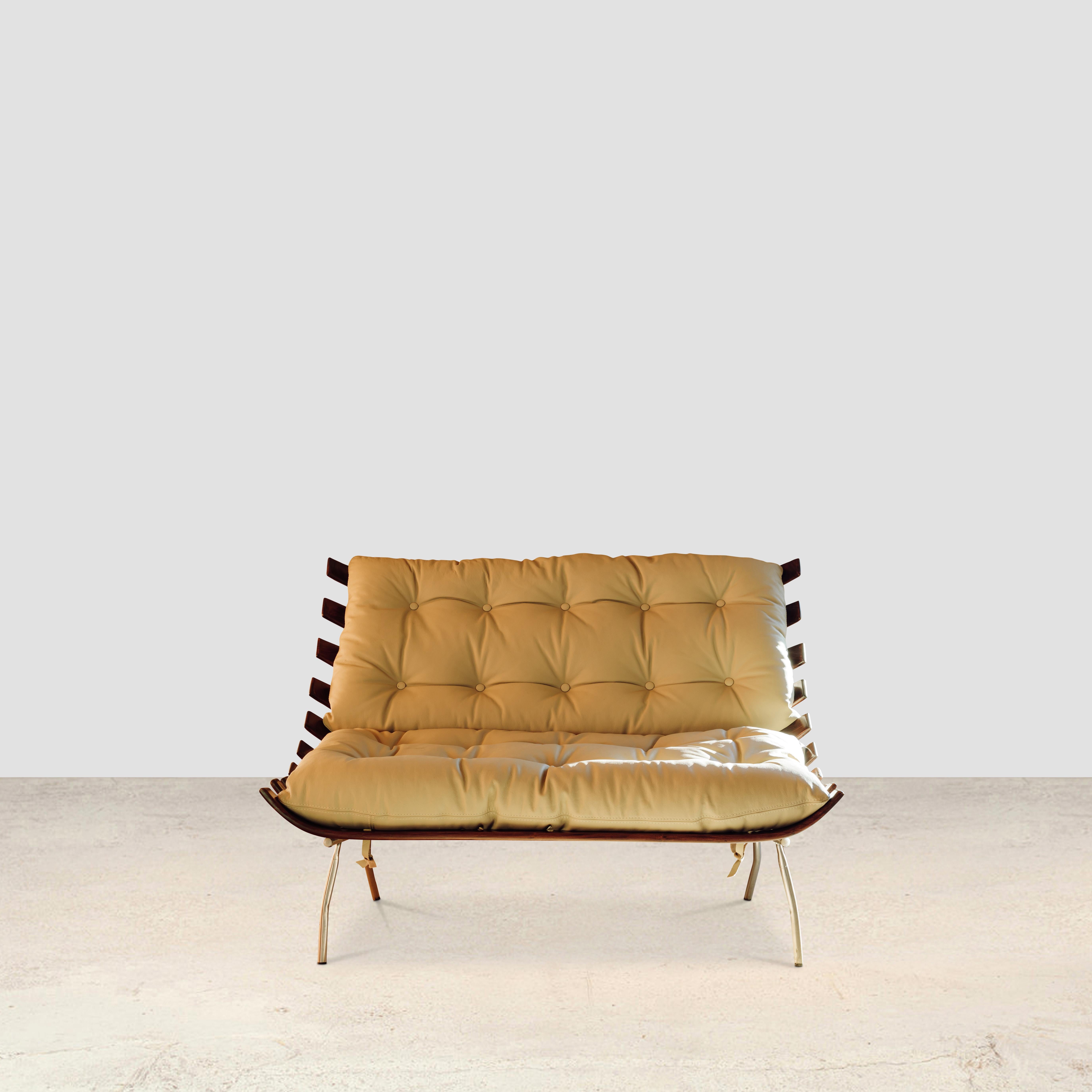 Costela sofa
By Carlo Hauner 1950

The costela lounge chair has become a hallmark of the designers Carlo Hauner and Martin Eisler. Using an iron frame, slats of solid wood are positioned in equal distances embracing loose cushions, one for the