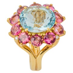 Imperial Rosette-Ring „Costis“ aus 18 Karat Gold mit zentralem Aquamarin und Rubellit