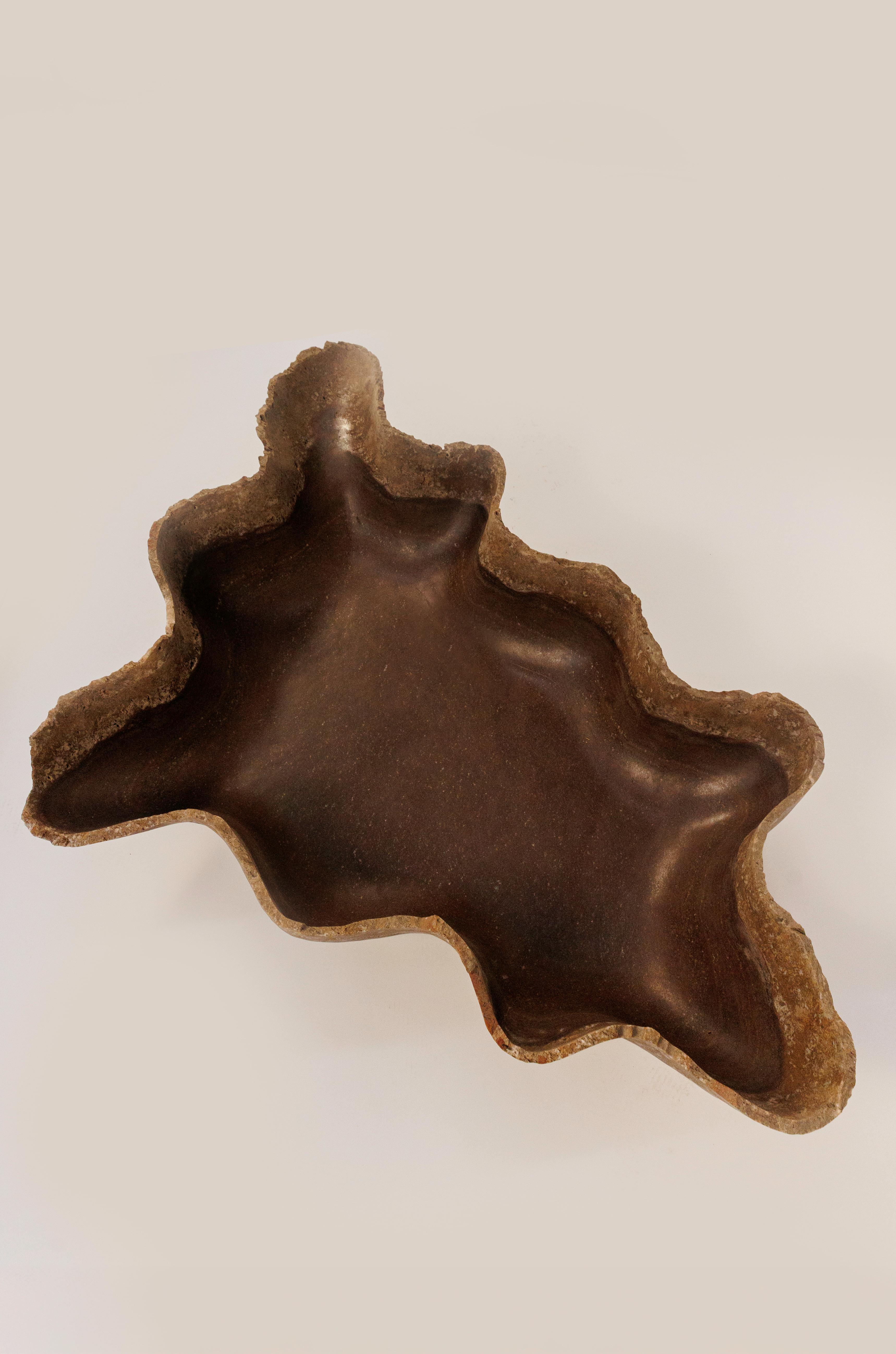 Carved from Mexican onyx found only in the northern region of Zacatecas, Costra de Tierra is a large-scale sculptural bowl that draws inspiration from the raw, textured crust of the earth. Its organic form and rich brown tones reflect the natural