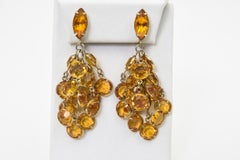 Costume-Ohrclips mit Citrin und Strass und Quaste