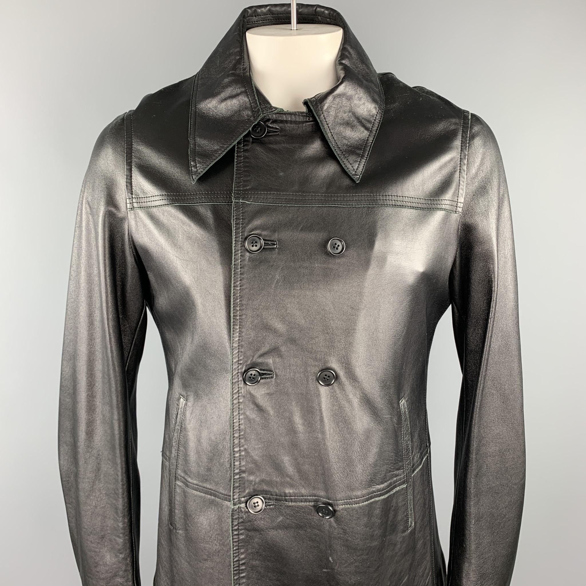 CoSTUME HOMME jacket comes in a black leather wit a quilted liner featuring slit pockets, pointed collar, and a double breasted closure.

Very Good Pre-Owned Condition.
Marked: 50

Measurements:

Shoulder: 17.5 in. 
Chest: 44 in. 
Sleeve: 28.5 in.