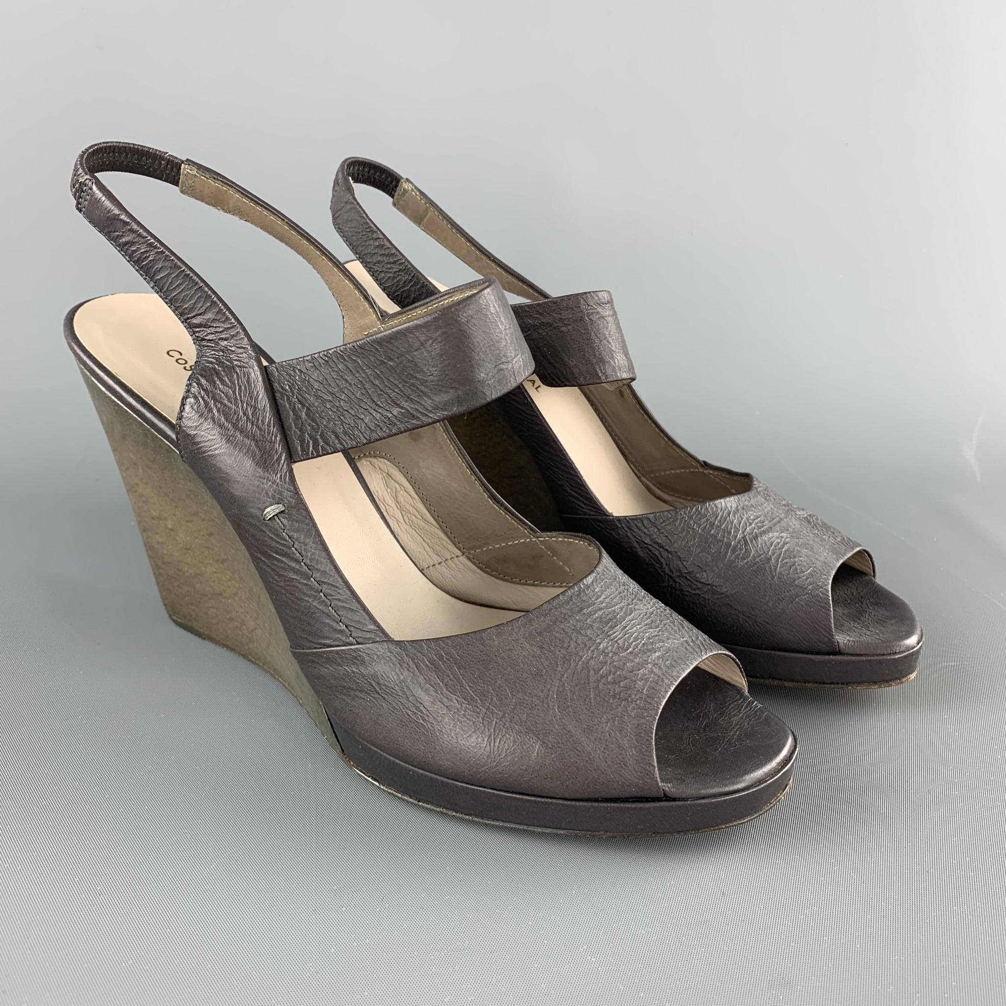 CoSTUME NATIONAL sandals come in grey leather with a Mary jane strap, slingback, and low platform, wedge sole. Made in Italy.

New without Tags.
Marked: IT 37.5

Heel: 4 in.
Platform: 0.5 in.
SKU: 101793
Category: Sandals

More Details
Brand: