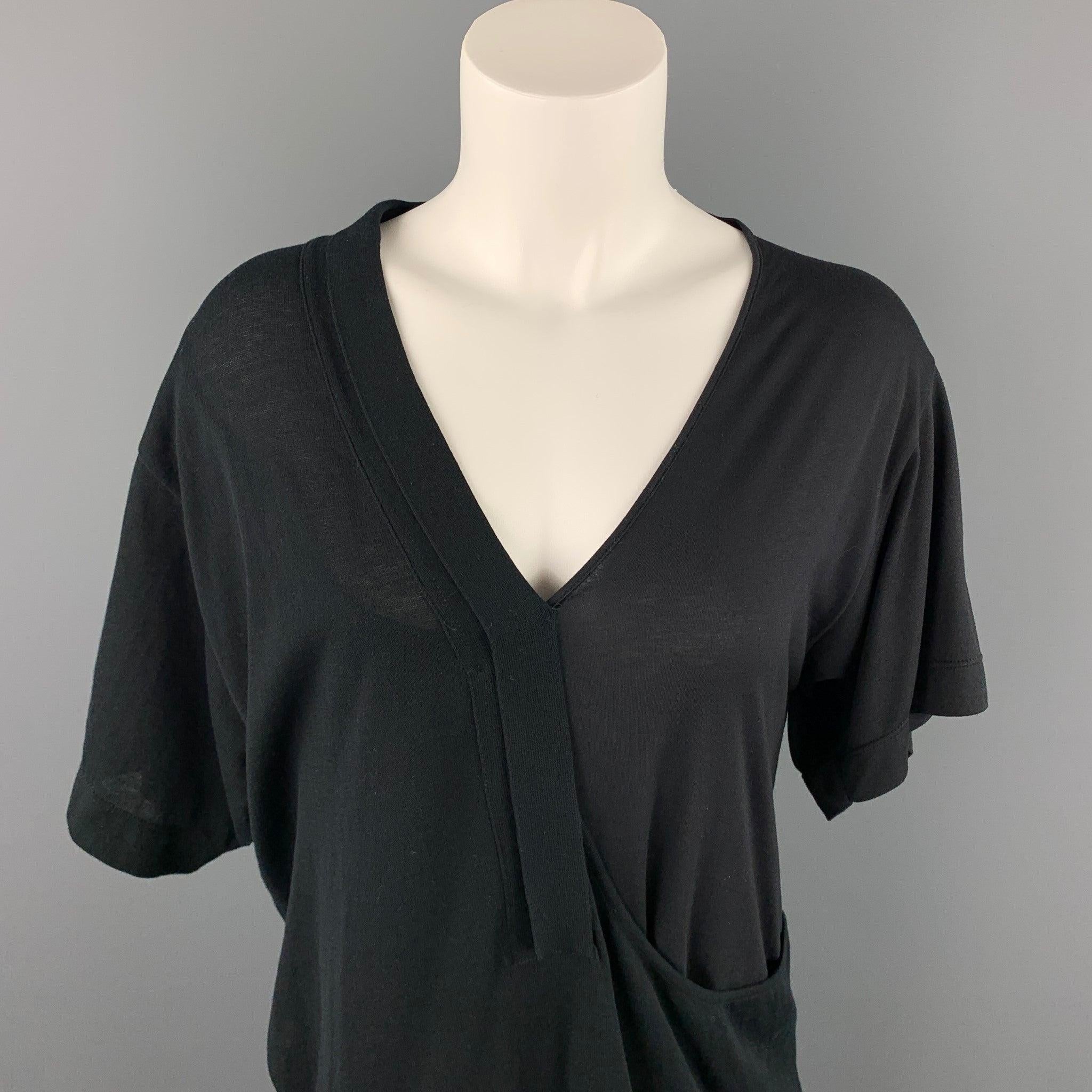 CoSTUME NATIONAL casual top comes in a black mixed fabric featuring a loose fit, layered style, and a v-neck.Very Good
Pre-Owned Condition. 

Marked:   S 

Measurements: 
 
Shoulder: 9 inches 
Bust: 40 inches 
Sleeve: 9 inches 
Length: 29.5 inches 
