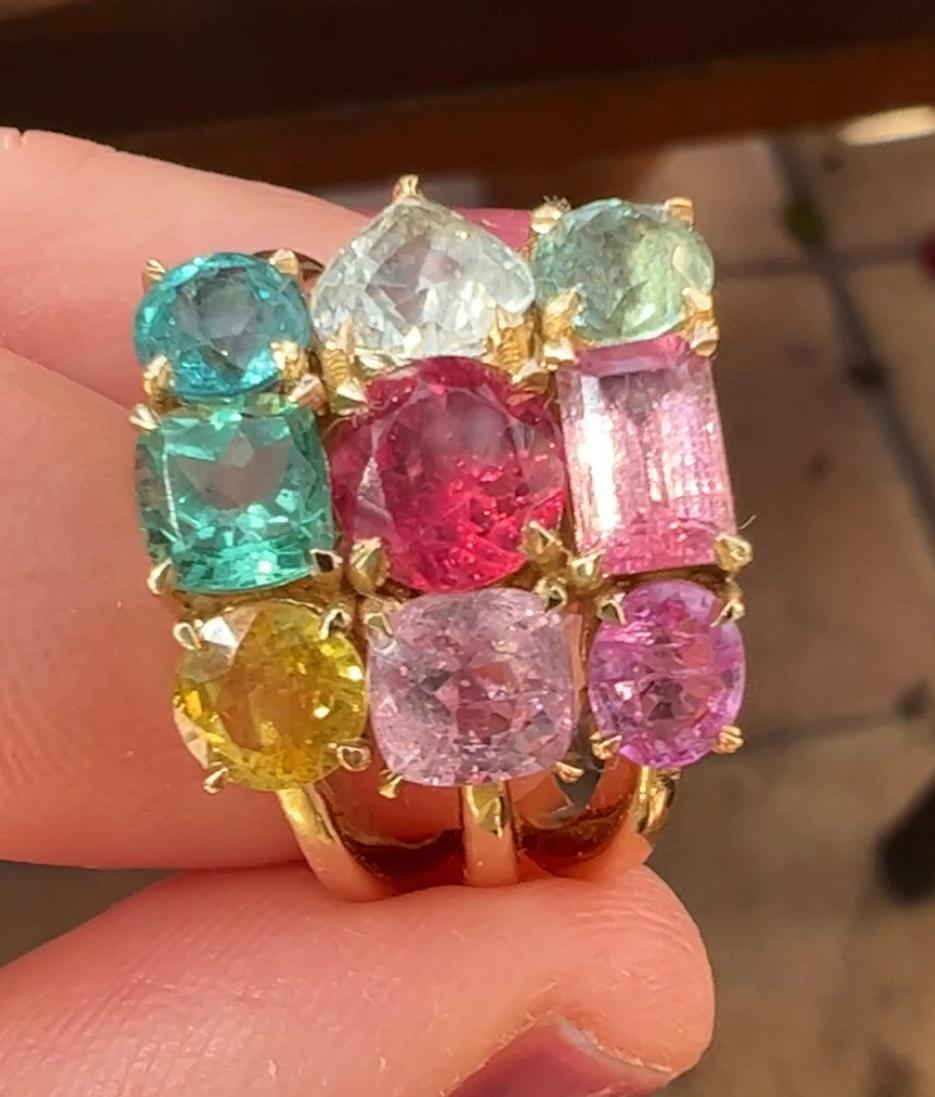 Discover the joyful collection of Aura rings by jewelry designer Jennifer Weir. The collection includes both three row, and single row gemstone rings. Set in 14 karat yellow gold, each stone is given its own special placement, and set in chunky