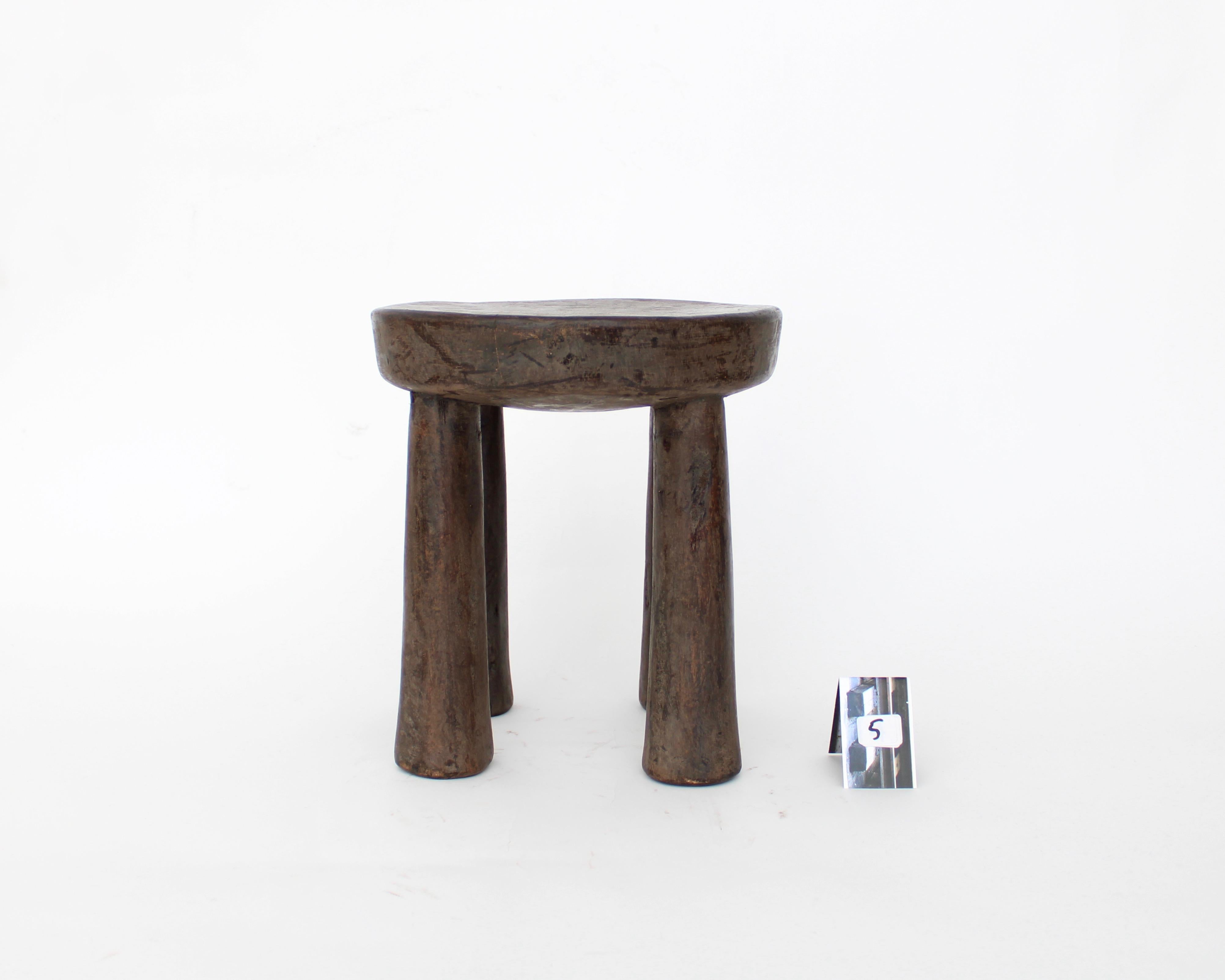 This African Lobi stool was created by the Lobi People of Ghana. It was carved from single blocks of wood, and has a wonderfully simple form. It has aged beautifully by use and exposure, and will bring history and authenticity into your space
The