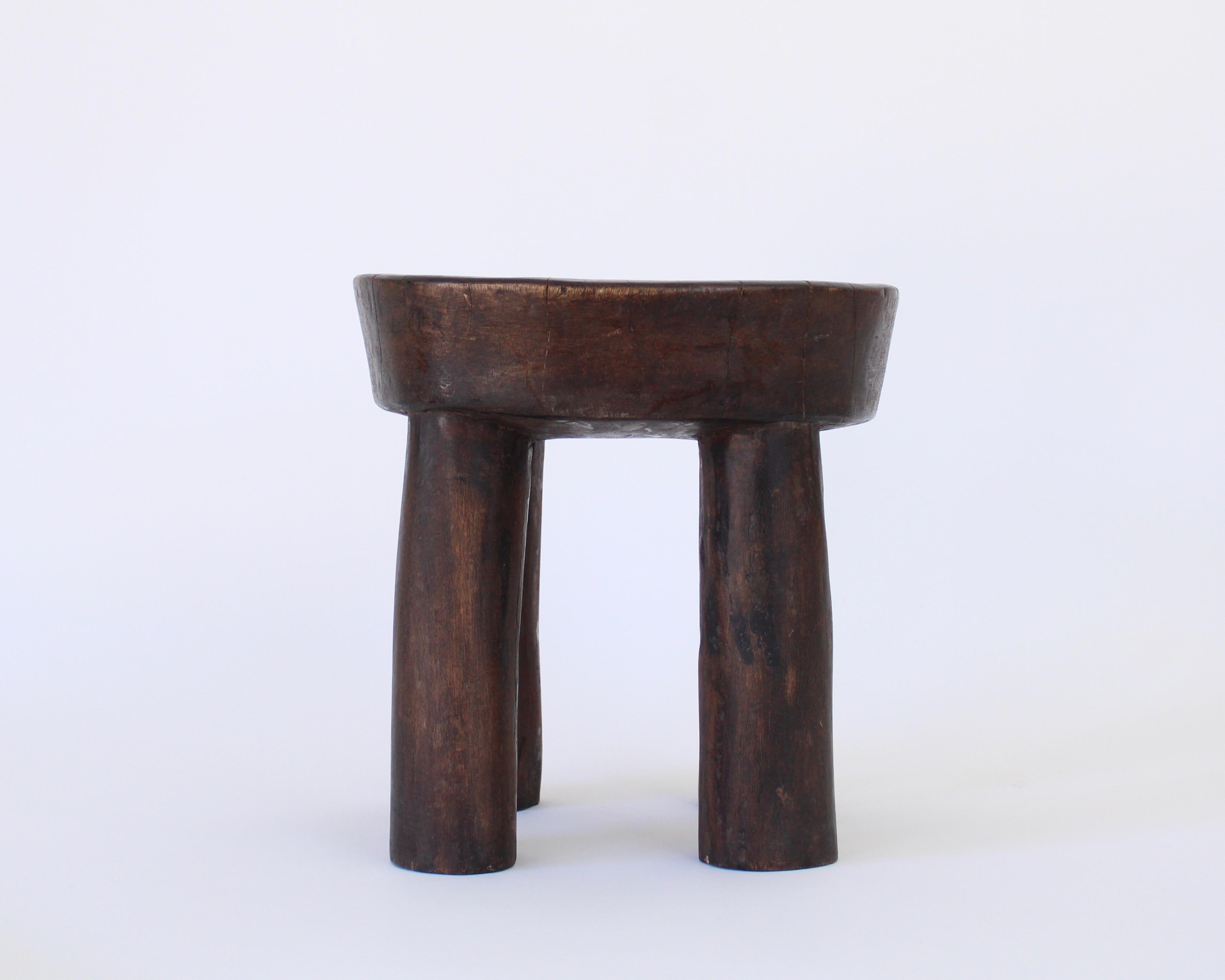 This African Lobi stool was created by the Lobi People of Ghana. It was carved from single blocks of wood, and has a wonderfully simple form. It has aged beautifully by use and exposure, and will bring history and authenticity into your space
The