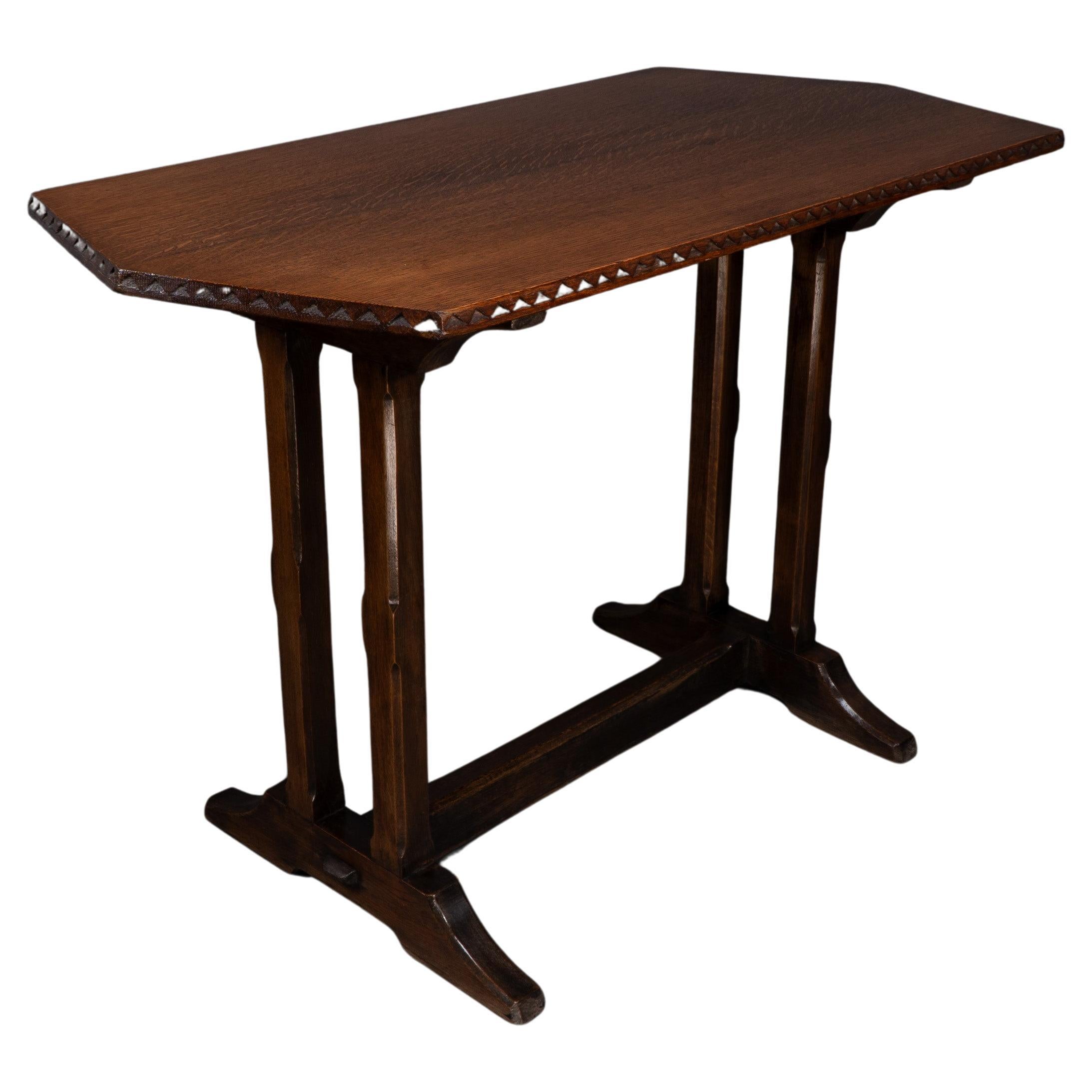 Cotswold style oak refectory dining or library table with carved chevron details
