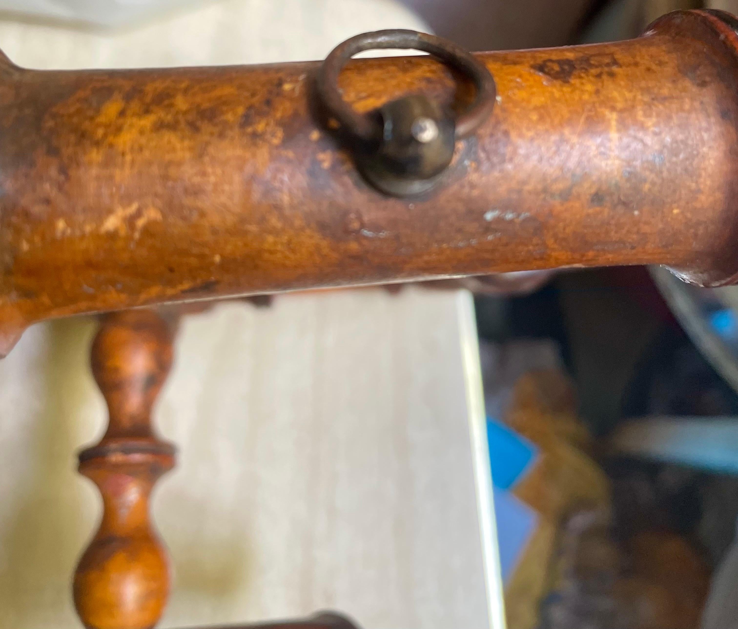 Here is a very nice faux bamboo wall hanging hat/coat rack with folding arms so it can be flat up against the wall when not in use. It is wonderfully carved from wood that has aged with a fantastic patina and the curved holders are more secure and