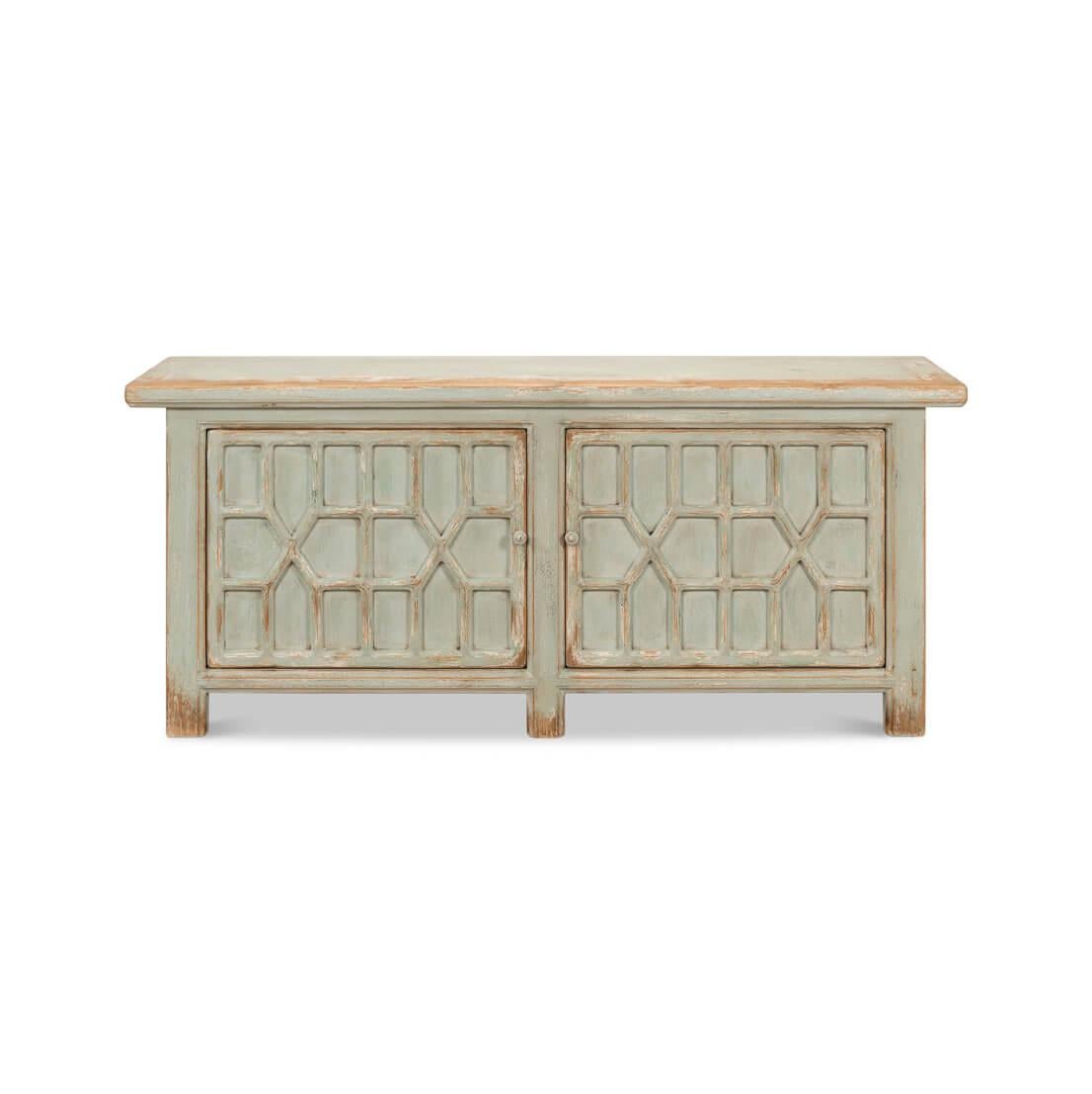 A piece that marries rustic allure with geometric sophistication. This sideboard features a soothing, sage green finish, subtly weathered to reveal hints of natural wood, suggesting a life alongside ocean breezes and salt spray.

The intricate