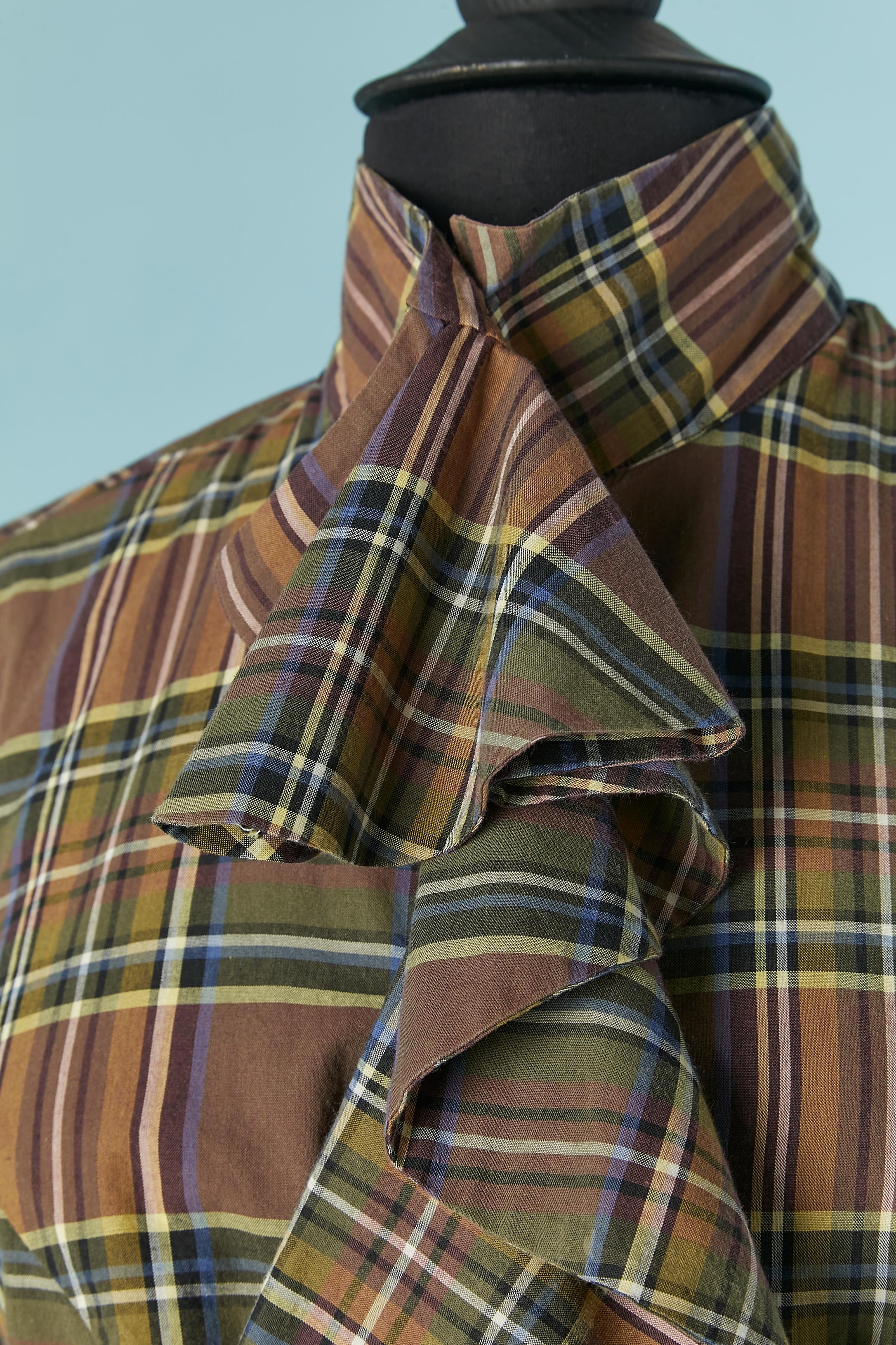 Cotton shirt with check pattern and ruffles jabot. Button and buttonhole closure on the middle front and branded button on the cuffs. One extra branded button provided. 
SIZE S 