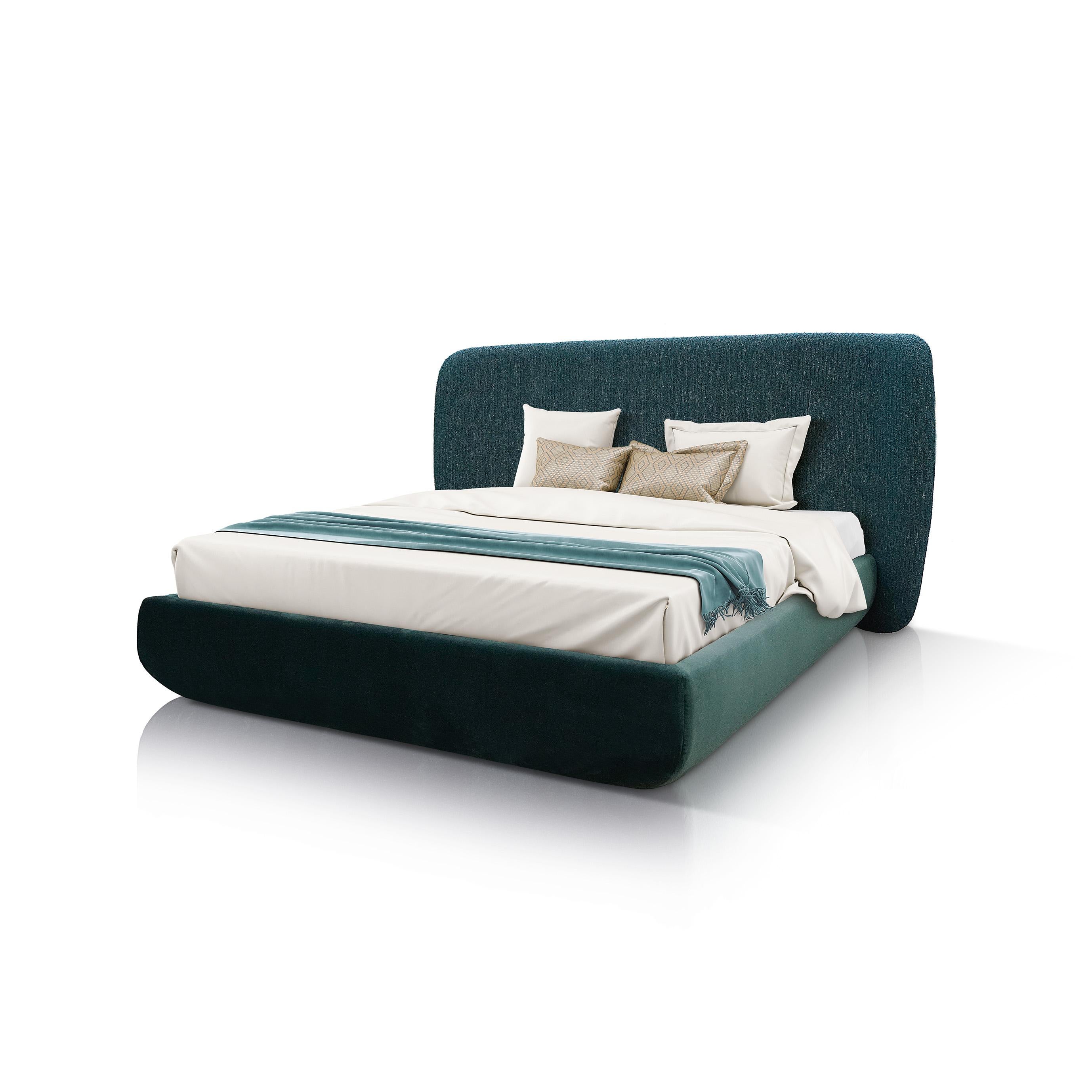 Designed to maximize floor space, this double bed combines style and function in a simple design of superb craftsmanship. Simple yet captivating, the frame is padded and upholstered in green velvet along the base, while the broad headboard is