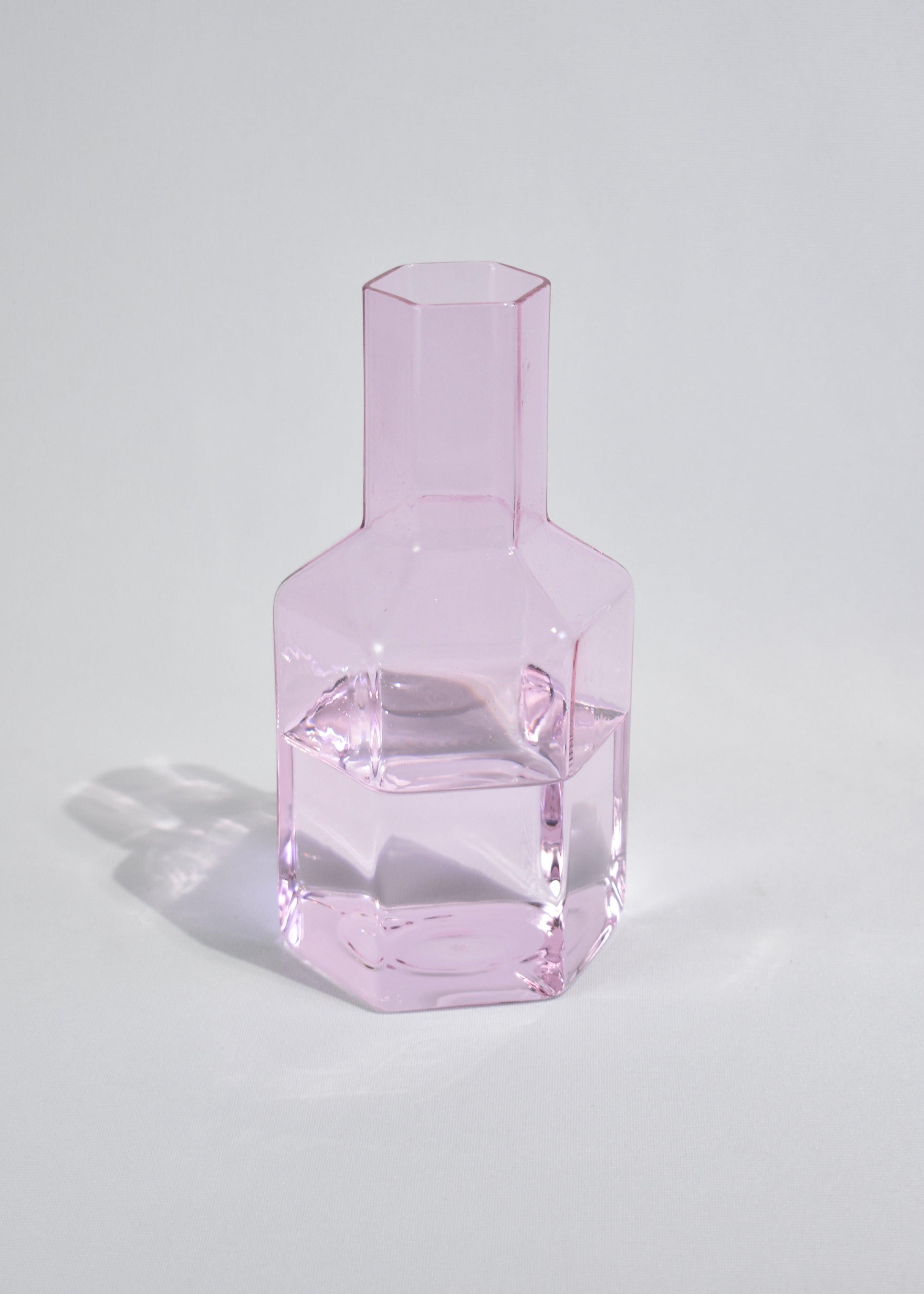 Pink glass carafe or vase in a faceted silhouette by Maison Balzac.

Food grade colored glass, individually mouth blown. 
Heat and cold resistant.
Hand wash recommended.