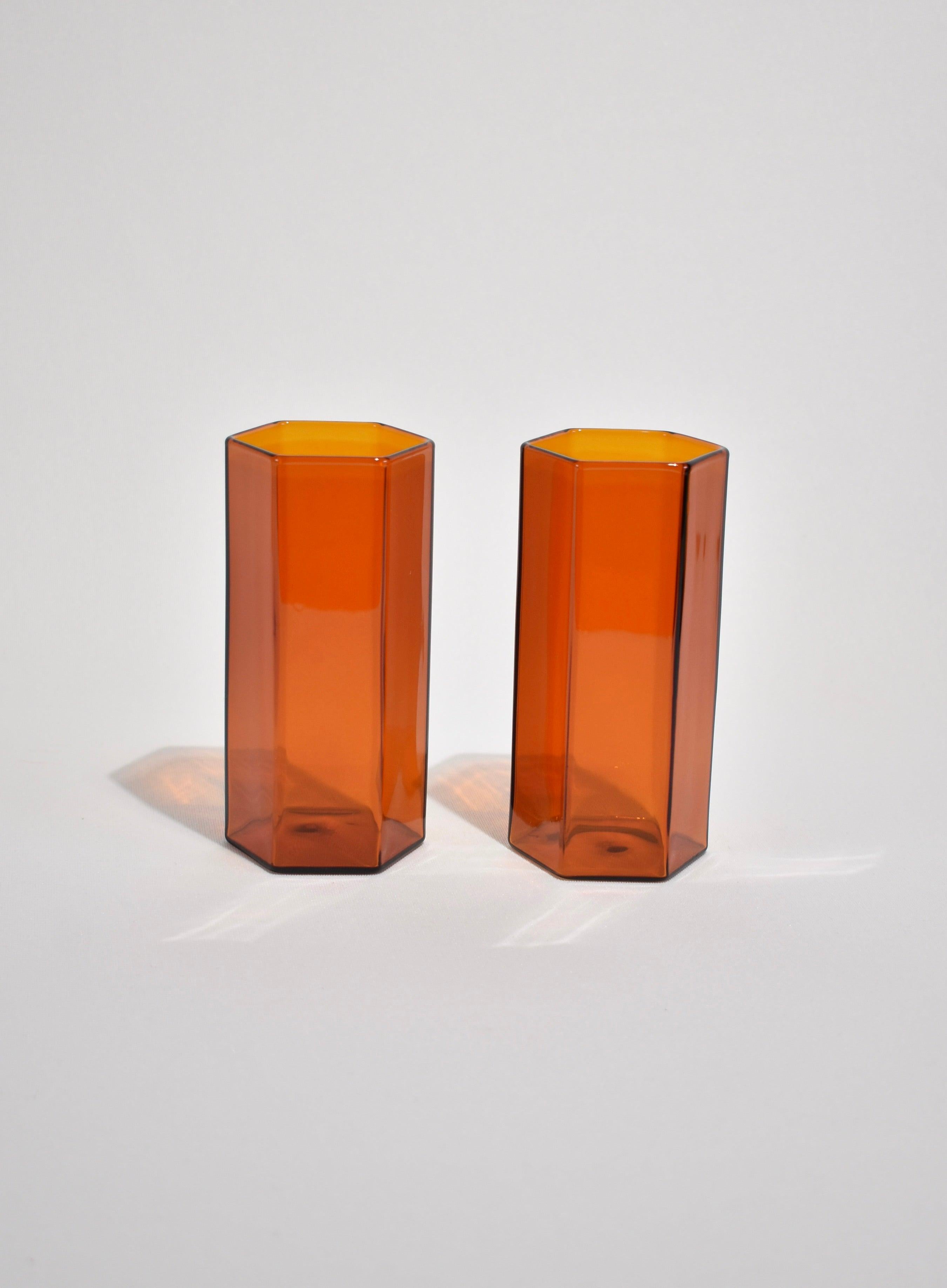 Set of two tall drinking glasses in a faceted silhouette by Maison Balzac.

Food grade colored glass, individually mouth blown. 
Heat and cold resistant.
Hand wash recommended.