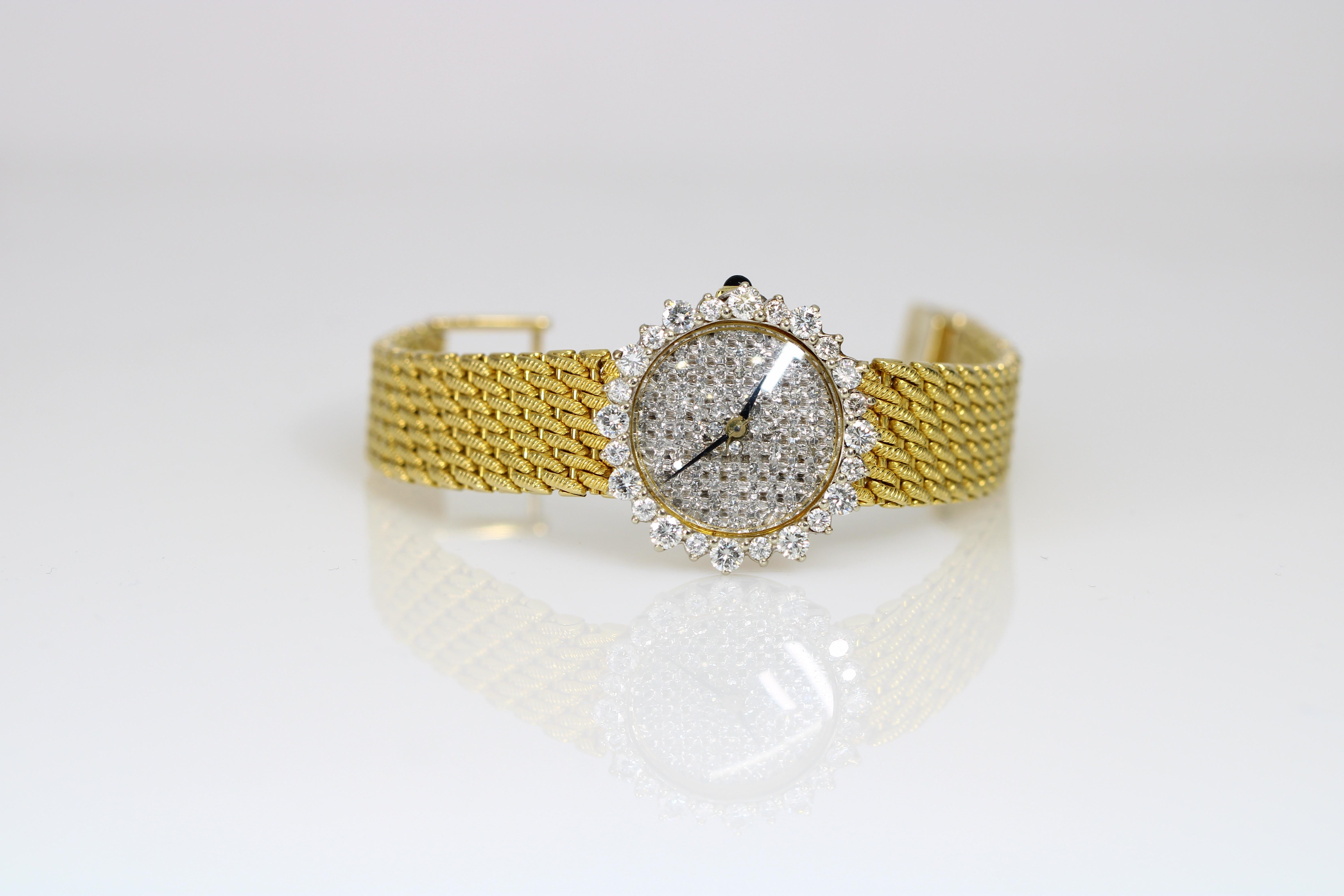 Presenting the exquisite Cartier Cougar Ladies Watch, measuring 26mm. This timepiece is crafted from solid yellow gold, featuring a factory diamond double row bezel and a diamond-encrusted bracelet. It houses a precise quartz movement and is