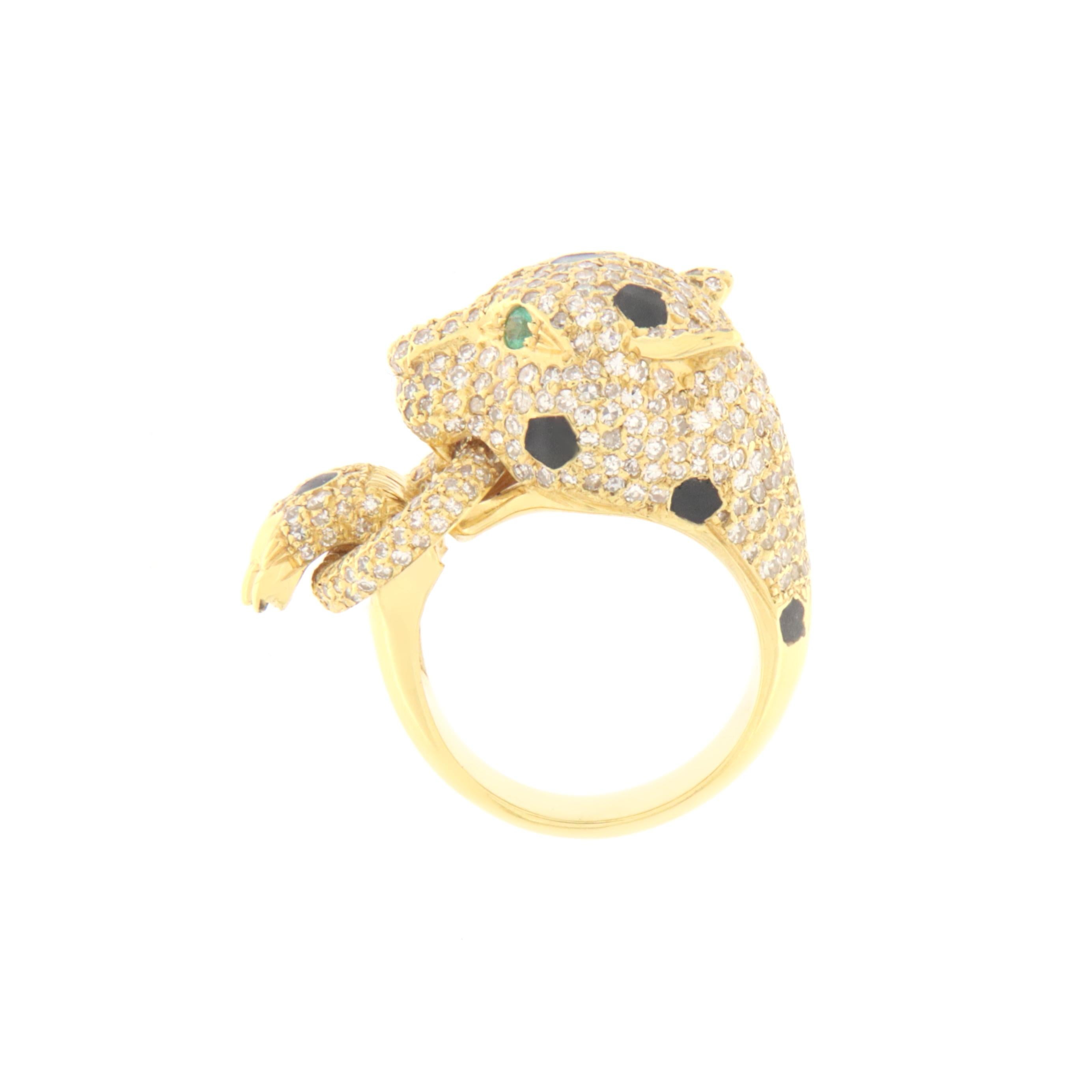 Gorgeous cougar ring in 18 karat yellow gold studded with diamonds and with two emeralds in the eyes there are also shades of black enamel, this fabulous ring was created by our artisans in southern Italy.

Ring total weight 15 grams
Diamonds weight