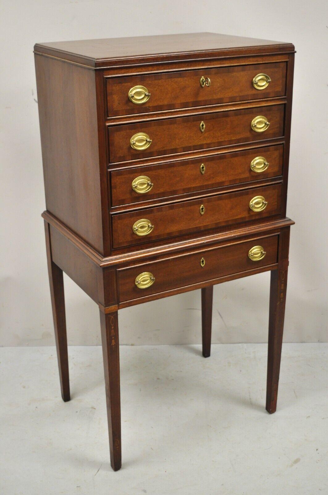 Council Craftsman Sheraton Style mahogany silverware chest with Inlay. Item features pinwheel inlay to legs, banded drawer fronts, working lock and key, 5 dovetailed drawers, quality American craftsman. Circa Mid to Late 20th Century. Measurements:
