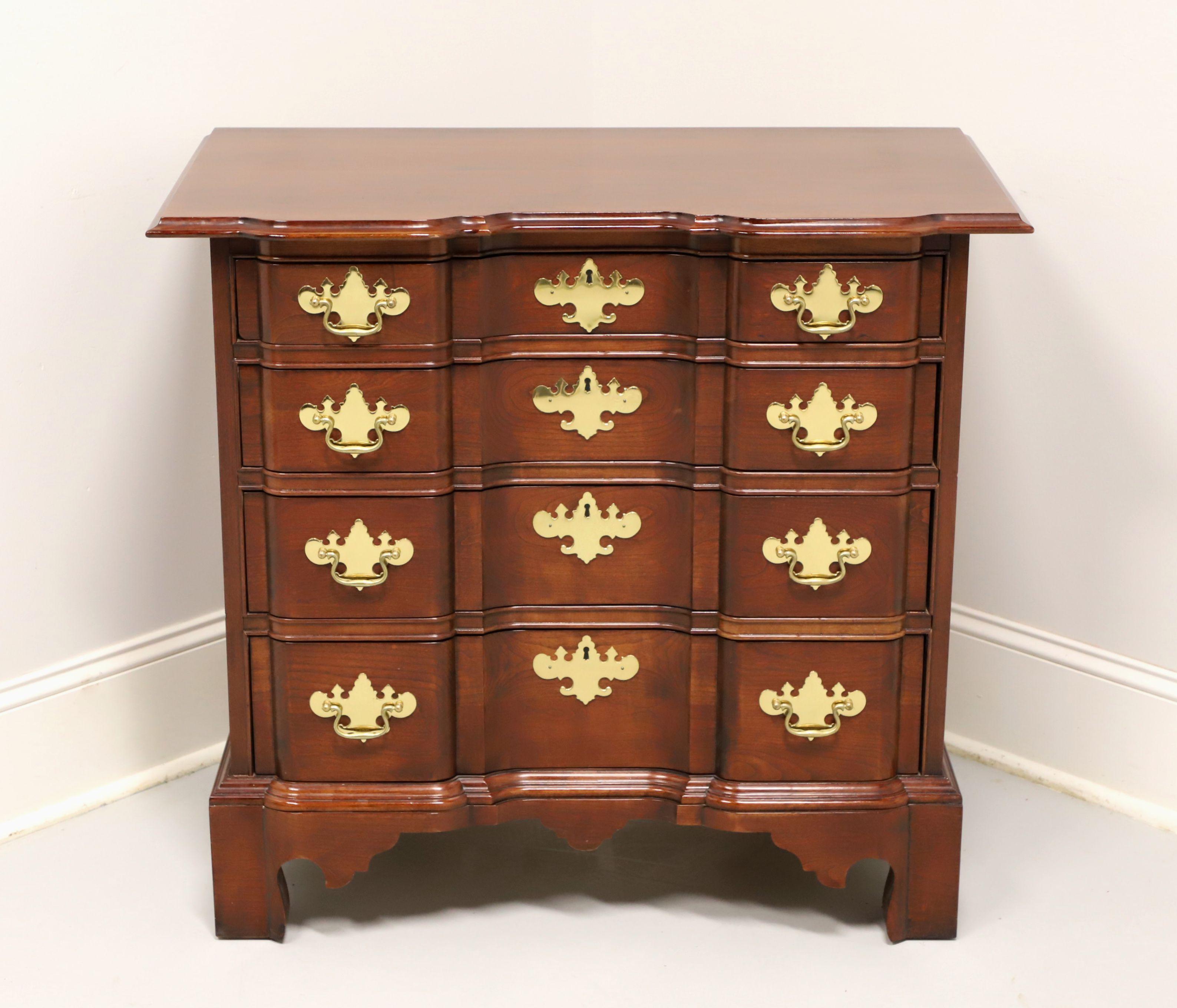 A Chippendale style block front bachelor chest by Councill Craftsmen. Solid cherry with brass hardware and bracket feet. Features four drawers of dovetail construction with faux keyhole escutcheons. Made in the USA, in the late 20th