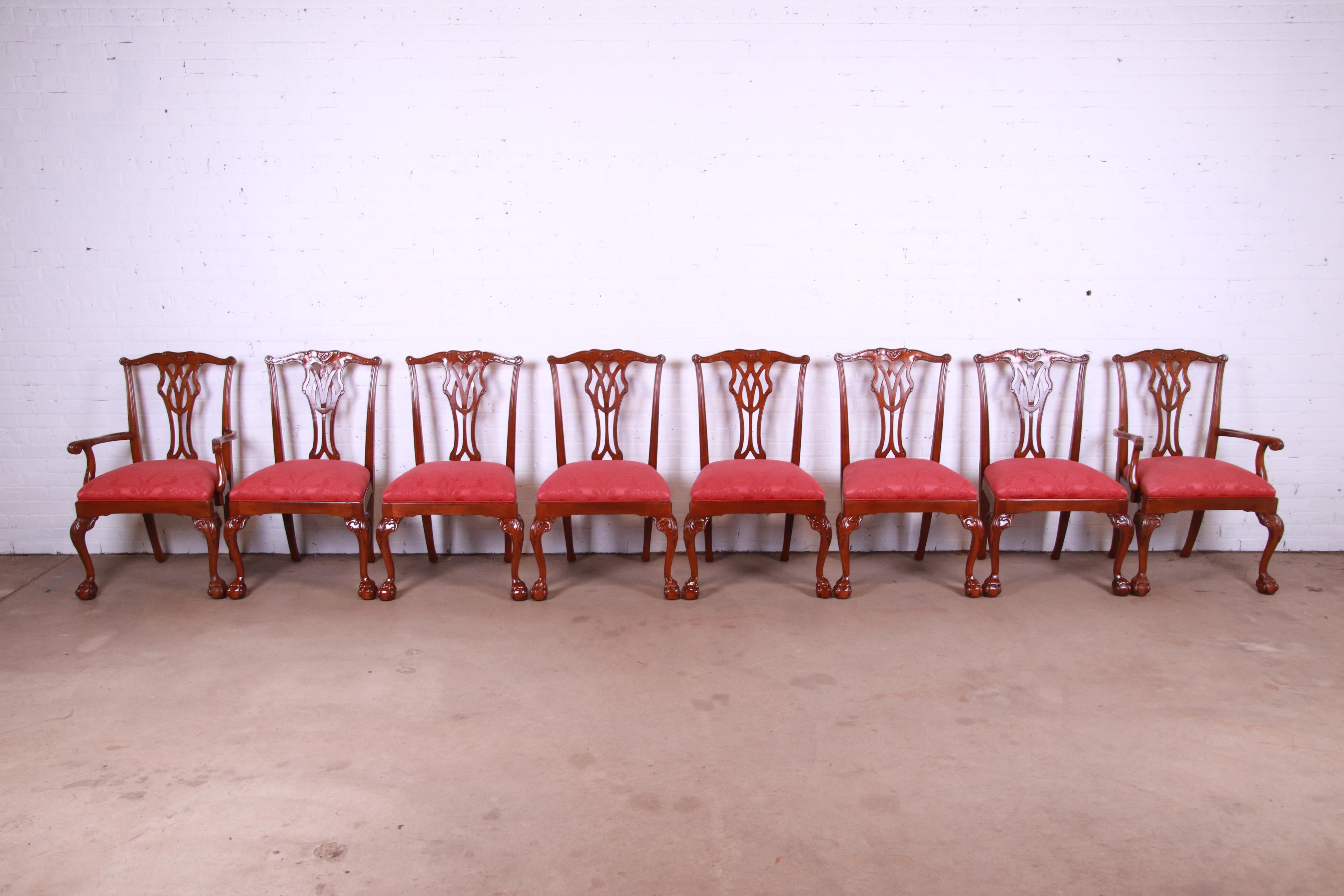 A gorgeous set of eight Chippendale style dining chairs with ball and claw feet

By Councill Furniture

USA, Circa 1980s

Solid carved mahogany frames, with red damask upholstered seats.

Measures: 25.25