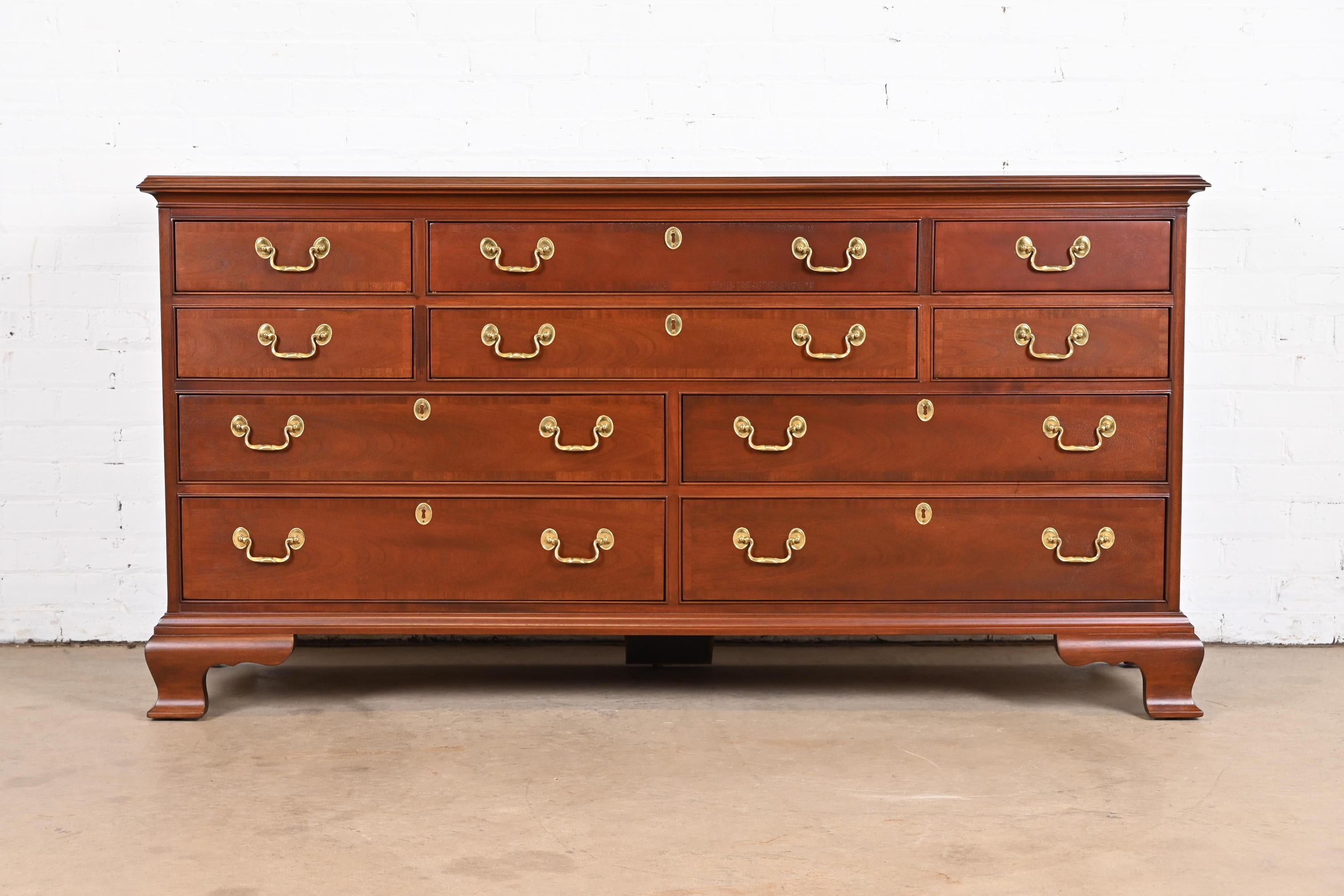 An exceptional Georgian or Chippendale style ten-drawer dresser or credenza

By Councill Furniture

USA, Circa 1980s

Carved solid mahogany, with original brass hardware.

Measures: 66