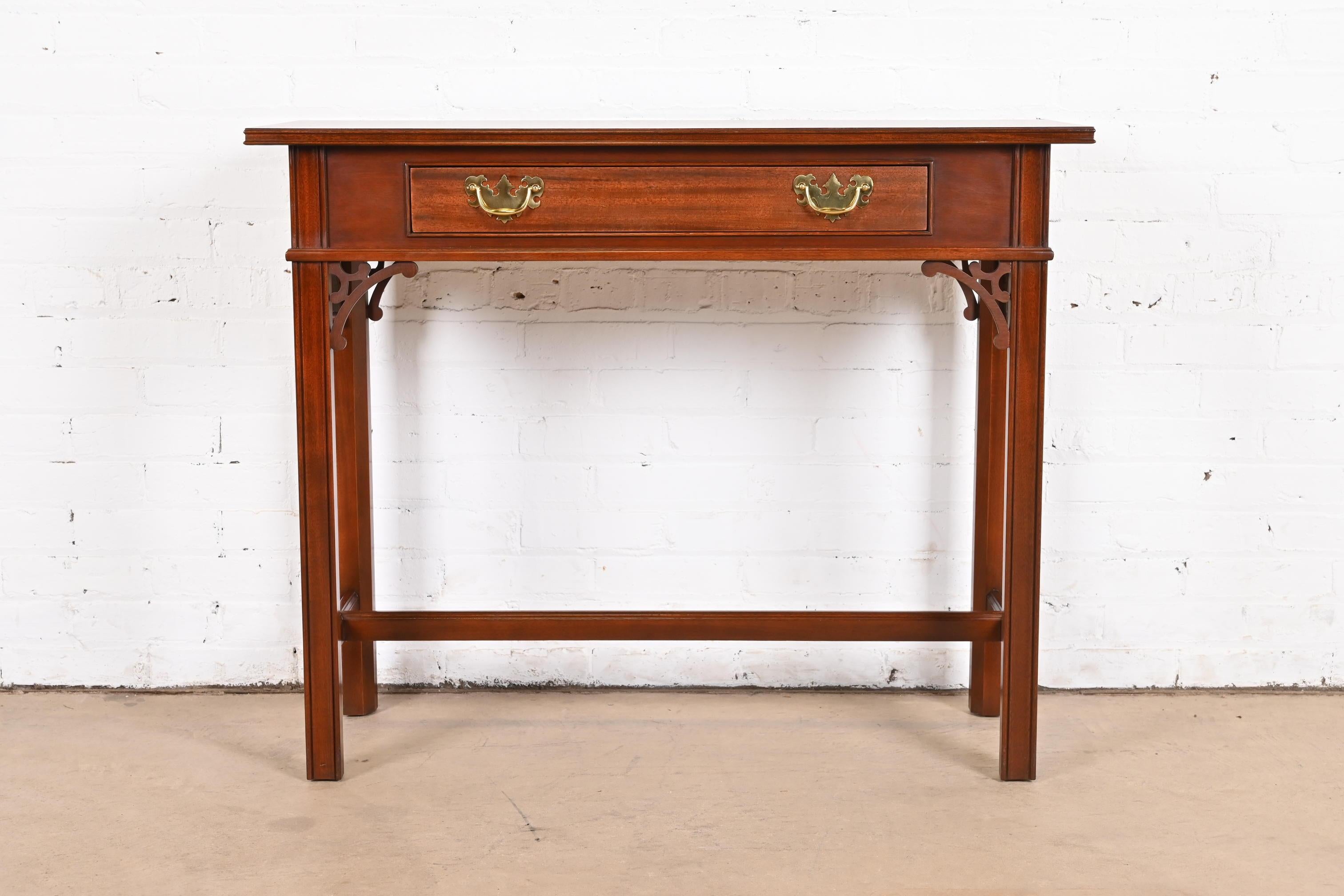 A gorgeous Georgian or Chippendale style buffet server, sofa table, or console table

By Councill Furniture

USA, Circa 1980s

Carved mahogany, with banded mahogany top, and original brass hardware.

Measures: 40