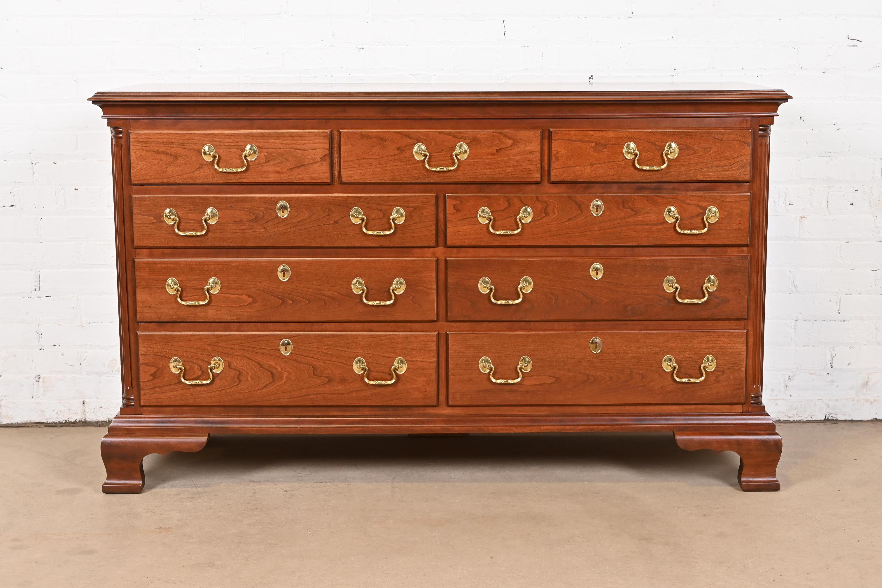 An exceptional Georgian or Chippendale style nine-drawer dresser or chest of drawers

By Councill Furniture

USA, Circa 1980s

Carved solid cherry wood, with original brass hardware.

Measures: 58
