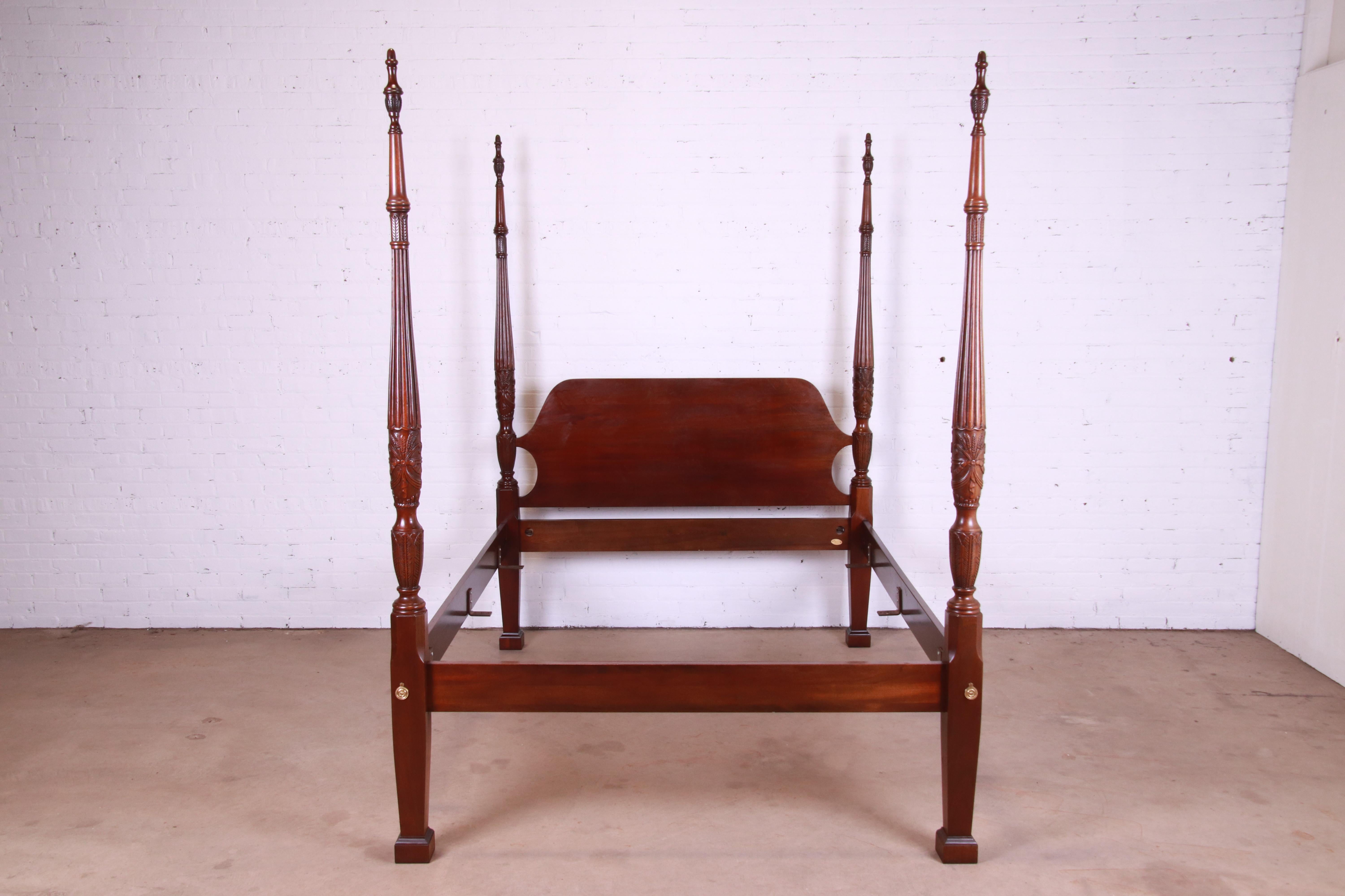 A gorgeous Georgian style four poster queen size bed frame

By Councill Furniture

USA, Circa 1980s

Carved mahogany, with brass accents.

Measures: 64