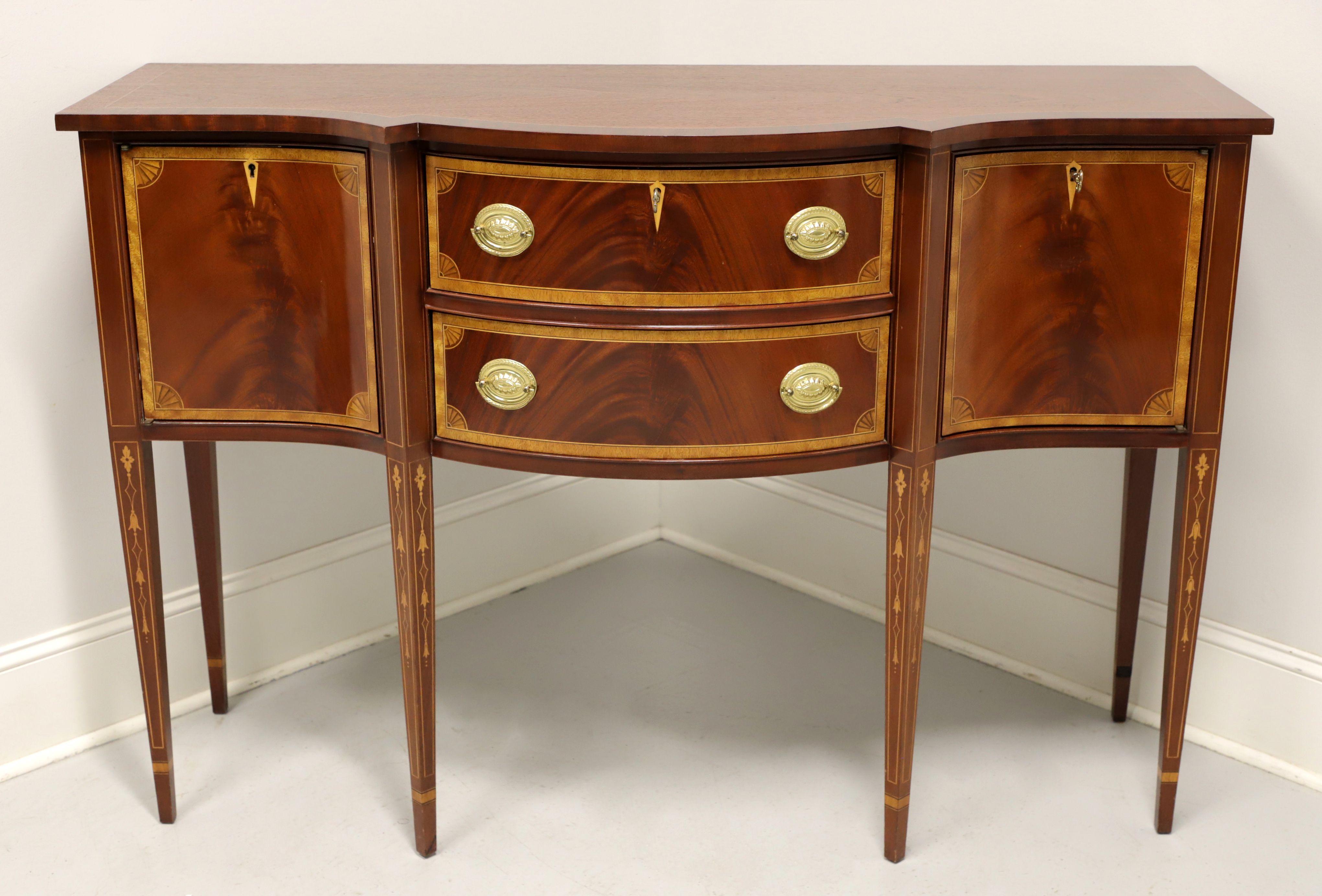 A Hepplewhite style sideboard by Councill. Flame mahogany, banded top, satinwood inlays to drawers, doors & legs, brass hardware and tapered straight legs. Features two center dovetail drawers, top drawer being lockable, flanked by lockable one door