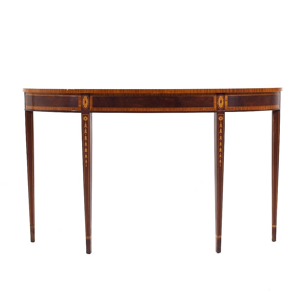 Councill Mahogany Inlaid Traditional Console Table

This console table measures: 54 wide x 15.5 deep x 32.25 inches high

About Photos: We take our photos in a controlled lighting studio to show as much detail as possible. We do not photoshop out