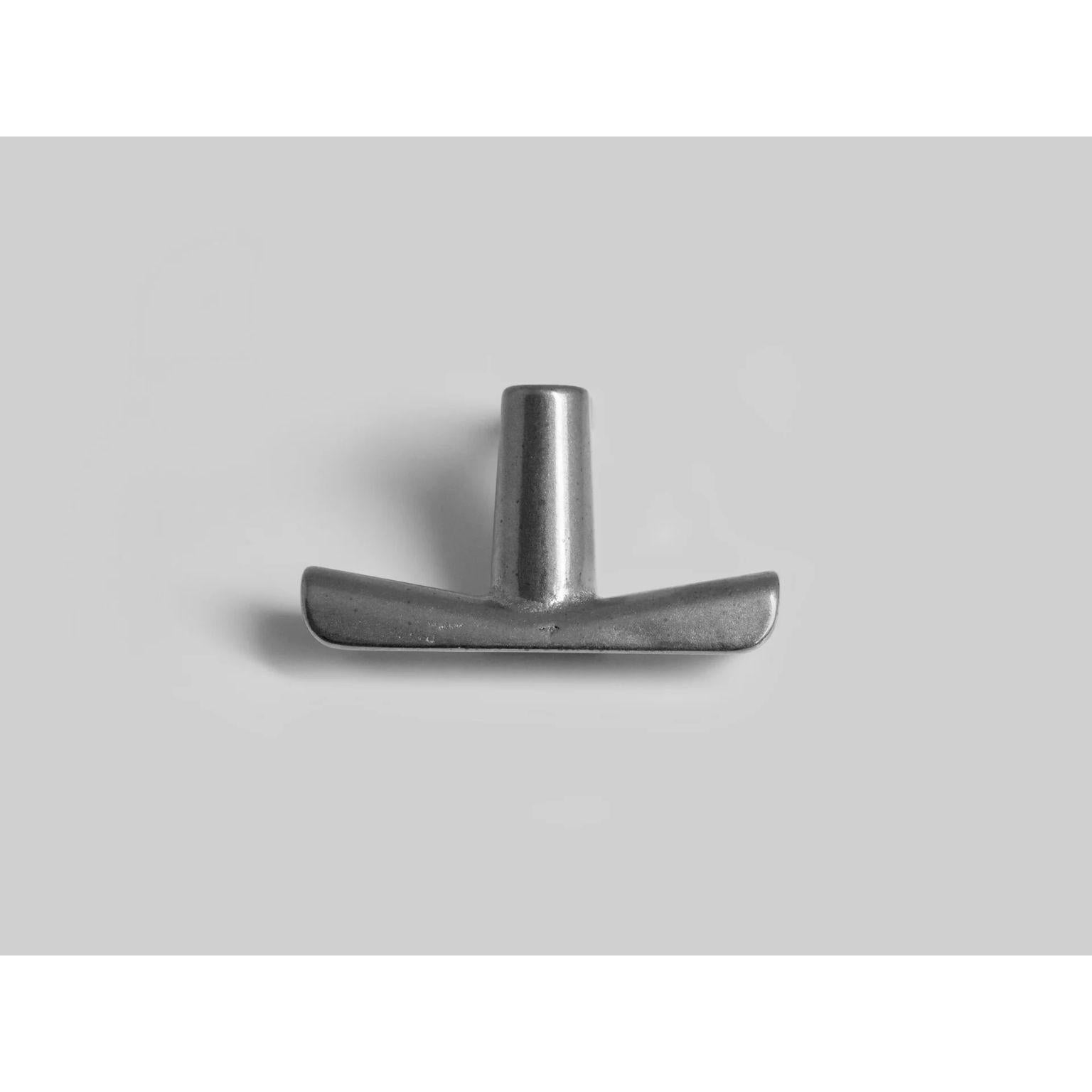 Aluminium Counter Hook by Henry Wilson
Dimensions: W 6 x D 4 x H 5 cm
Materials: Aluminium 

Designed for hanging bags and coats under bar counters. 
Each piece is sand cast in aluminium and rumble finished.
They are manufactured in small batches