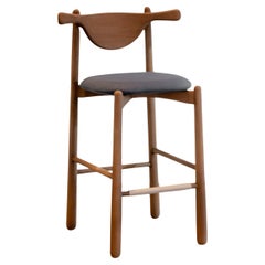 Sgabello da banco Aratú. Legno massiccio, seduta imbottita.