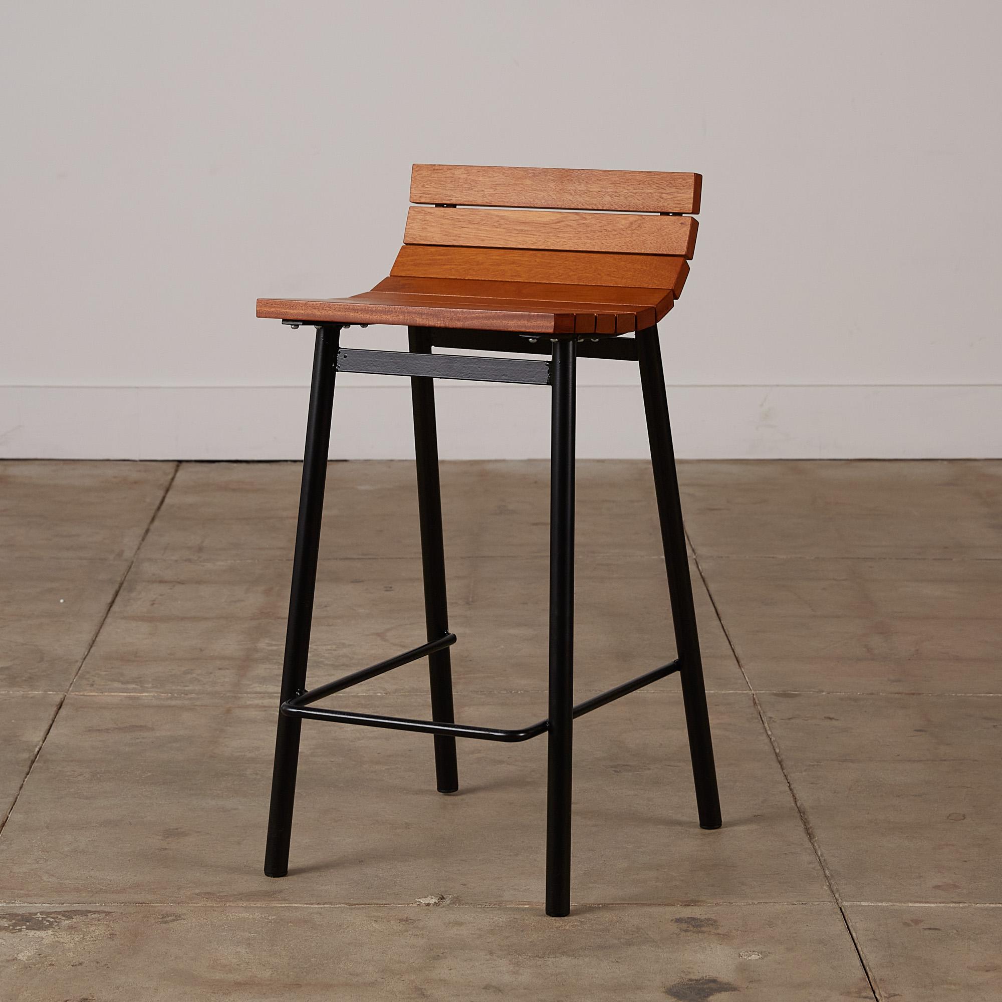 Counter stool by Vista of California, circa 1950s. This counter height stool features a newly powder coated tubular steel frame with a thinner strip of steel tubing serving as a mid-height structural support as well as a footrest. The stool also