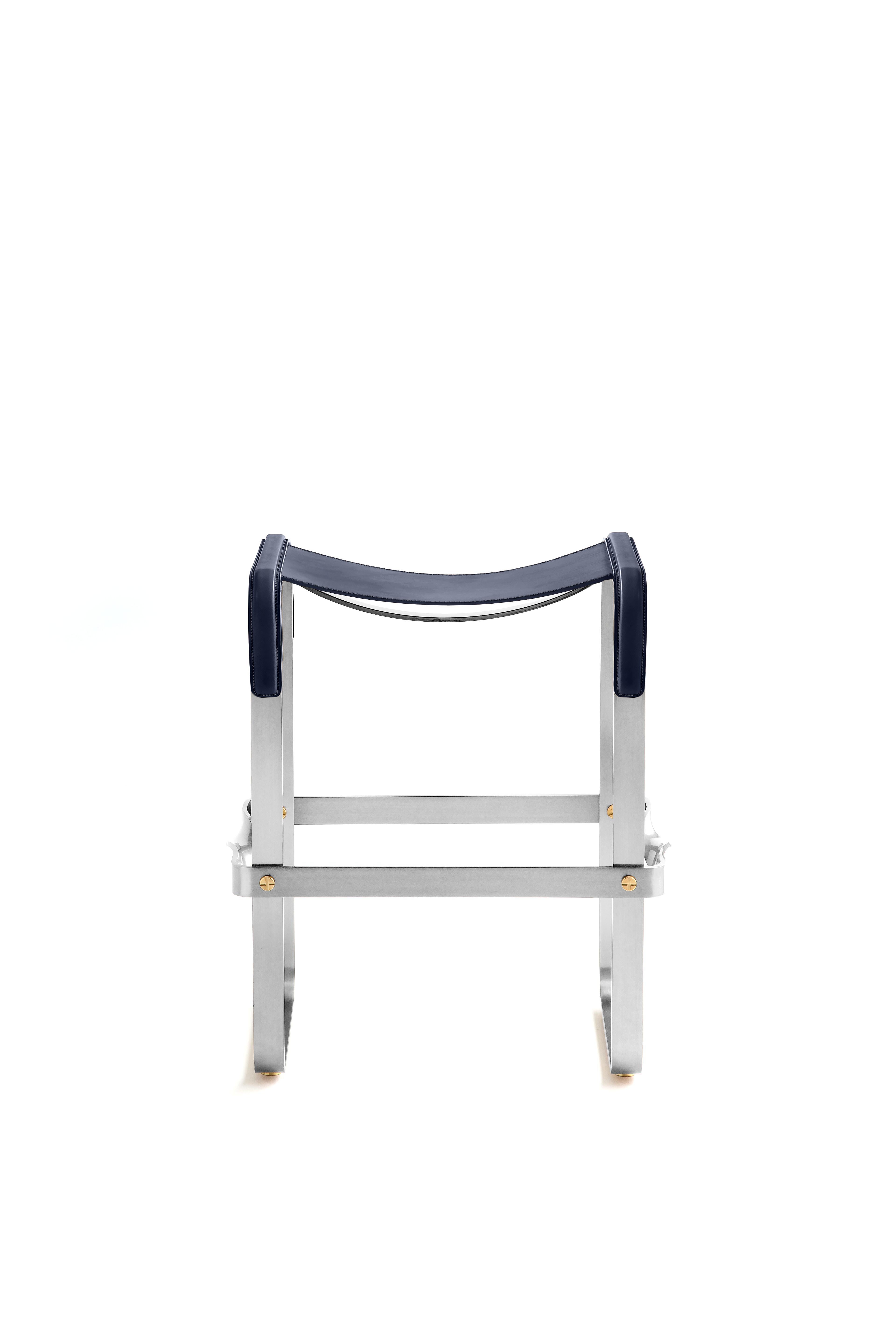 The Wanderlust contemporary counter stool belongs to a collection of minimalist and serene pieces where exclusivity and precision are shown in small details such as the hand-turned metal nuts and bolts that fix the leather surfaces, that go