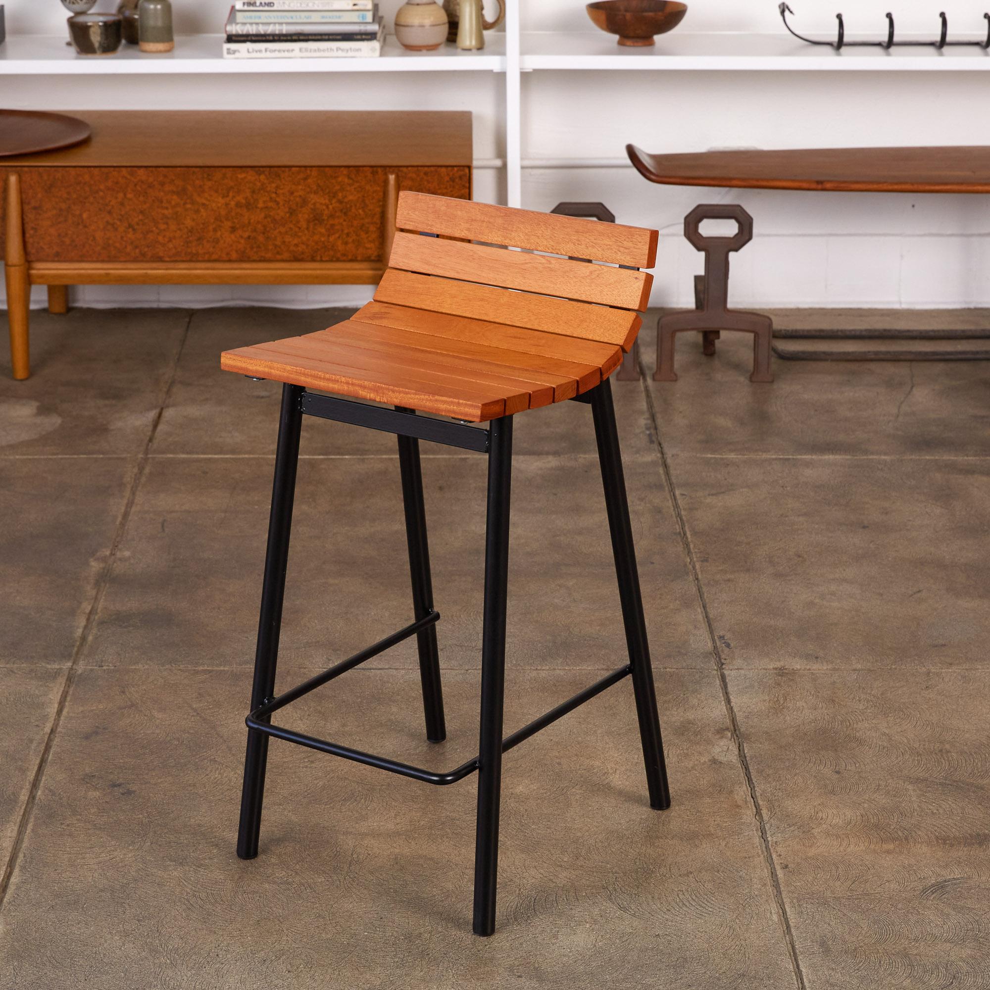Counter stool by Vista of California, circa 1950s. This counter height stools feature newly powder coated tubular steel frames with a thinner strip of steel tubing serving as a mid-height structural support as well as a footrest. The stool also