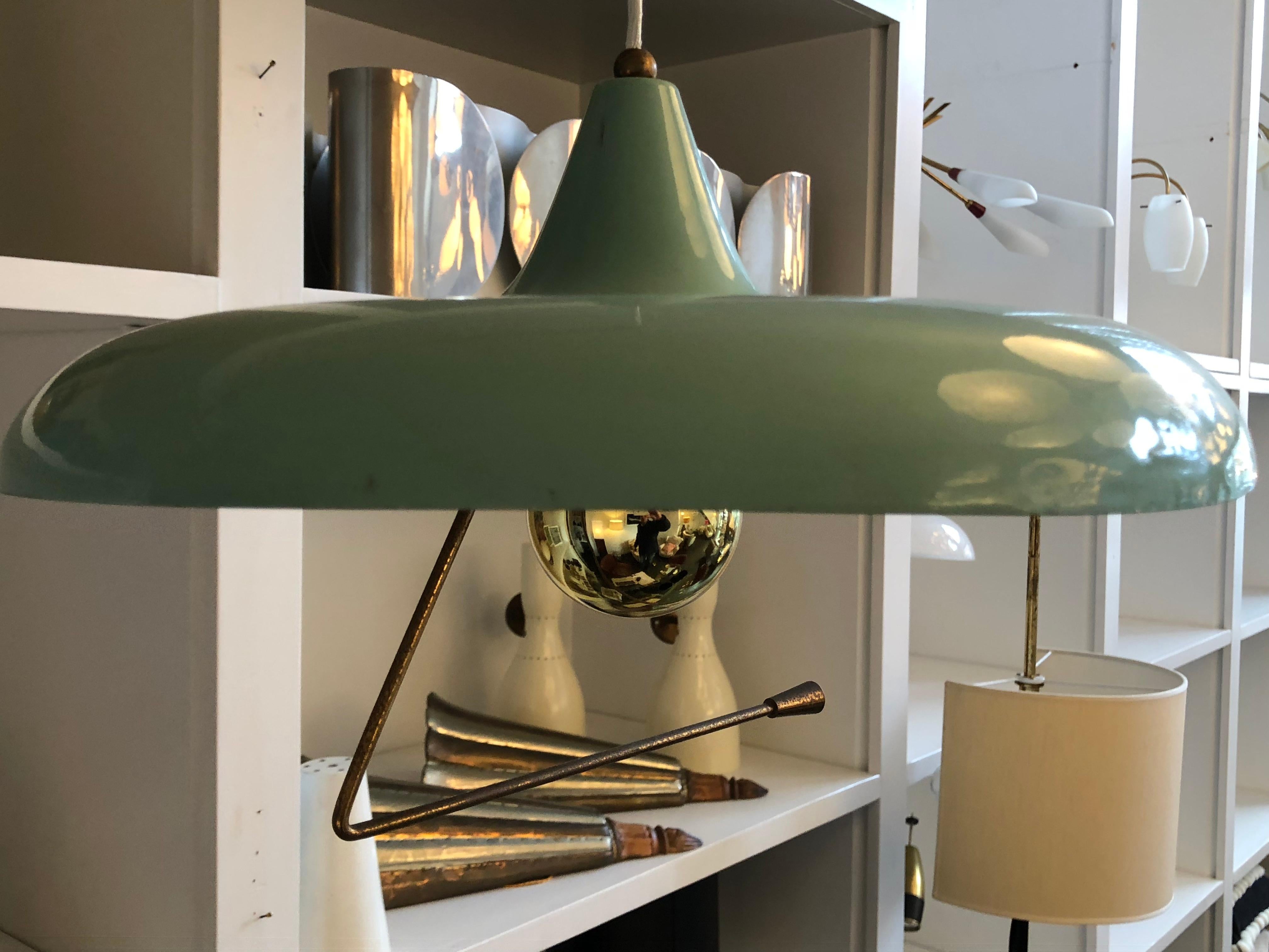 A brass counter-weight wall light by Stilnovo with telescopic (adjustable) arm that swivels 180 degrees. Can be mounted at any height. Metal Saucer pendant is also adjustable. Very flexible design. Has been rewired with step on floor switch, circa