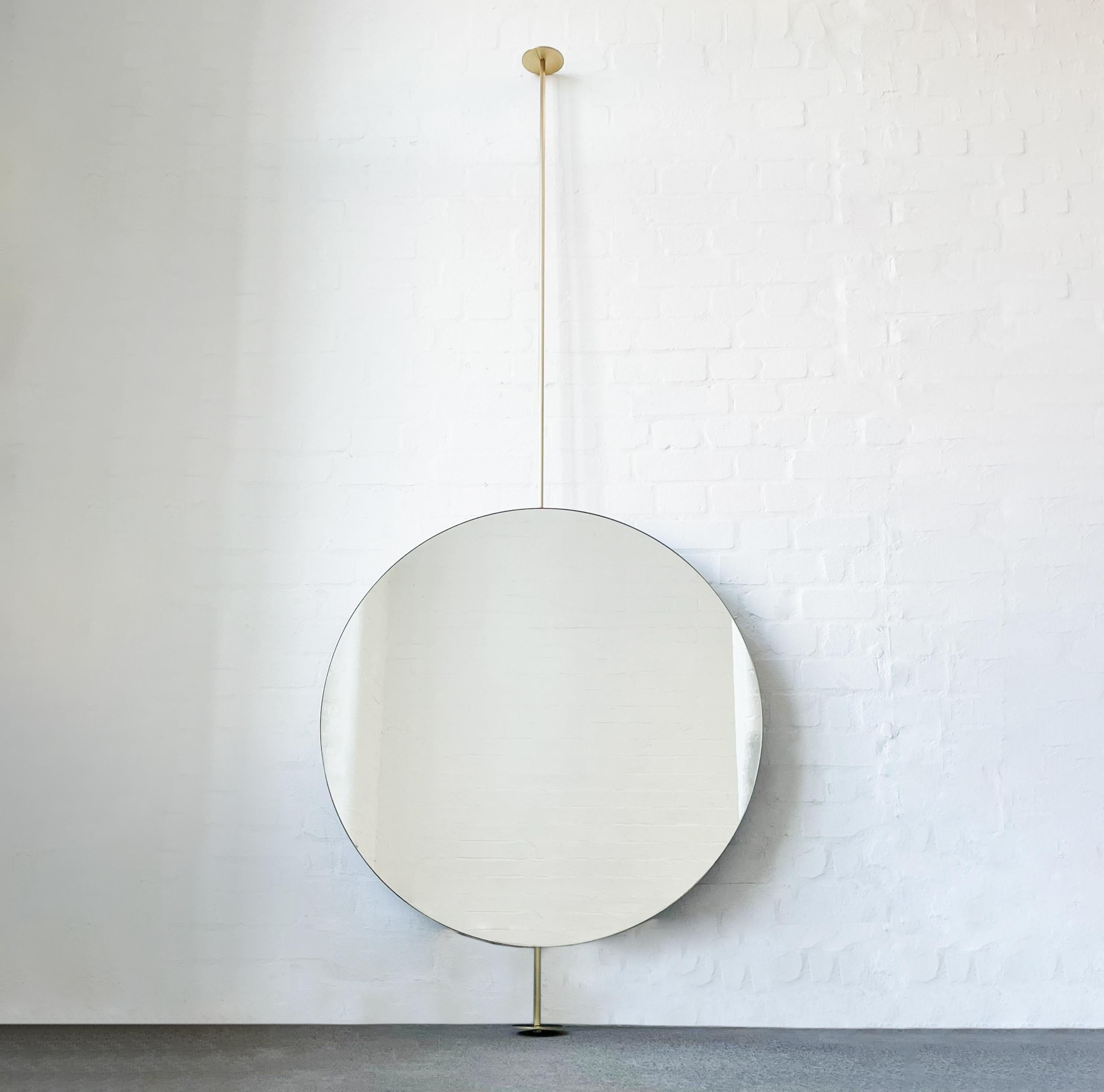 Orbis™ countertop to ceiling attached round mirror with a minimalist solid brushed brass frame. This mirror is fully customisable. Designed and handcrafted in London, UK.

Dimensions:

Diameter 91.4cm x Depth 3cm (Drop 111.7cm, Rise 15cm)
Diameter