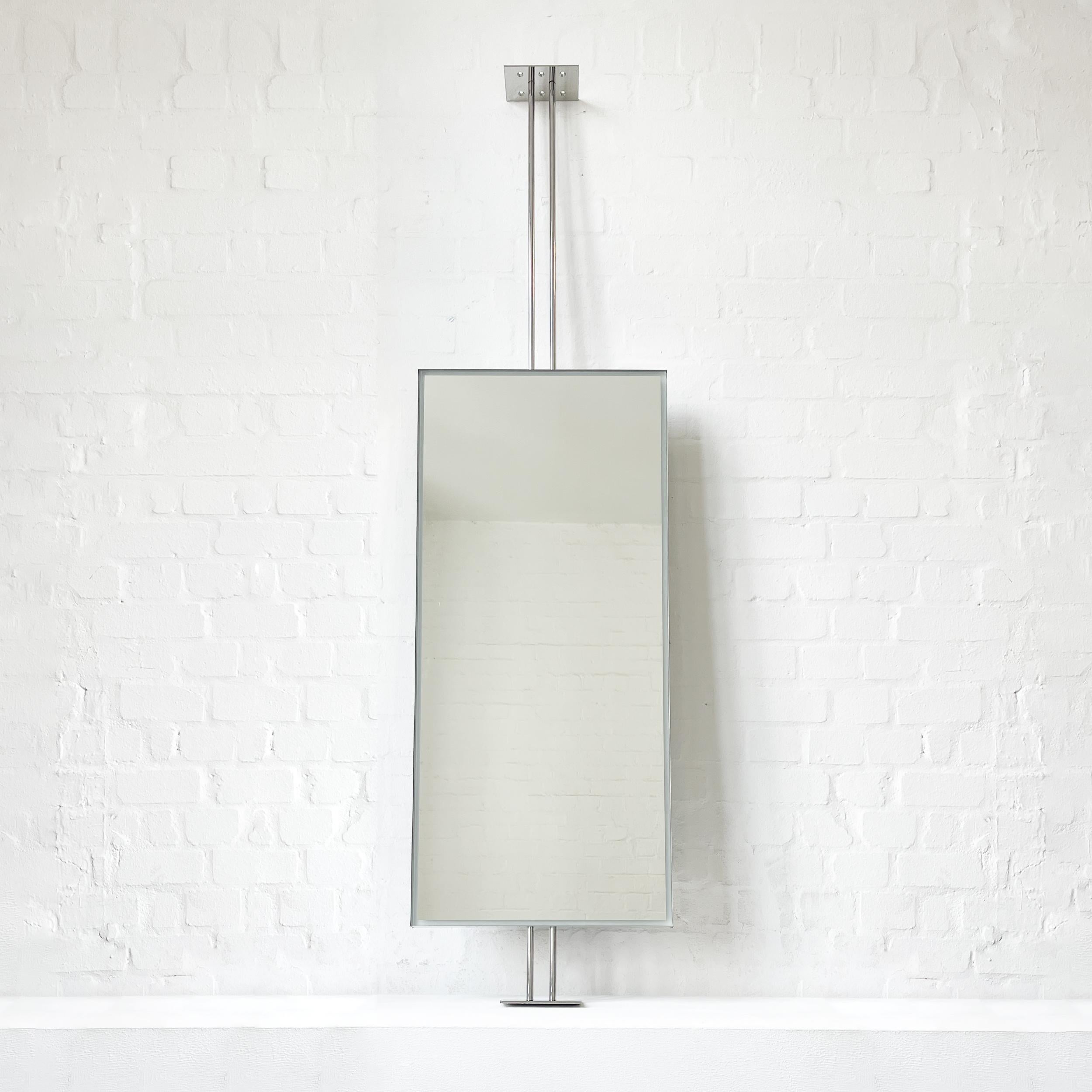Modern countertop to ceiling attached Quadris™ rectangular mirror with front illumination and a polished stainless steel minimalist frame. Designed and made in London, UK. This mirror is fully customisable.

Dimensions:

H 102cm x W 45.5cm x D 4.1cm