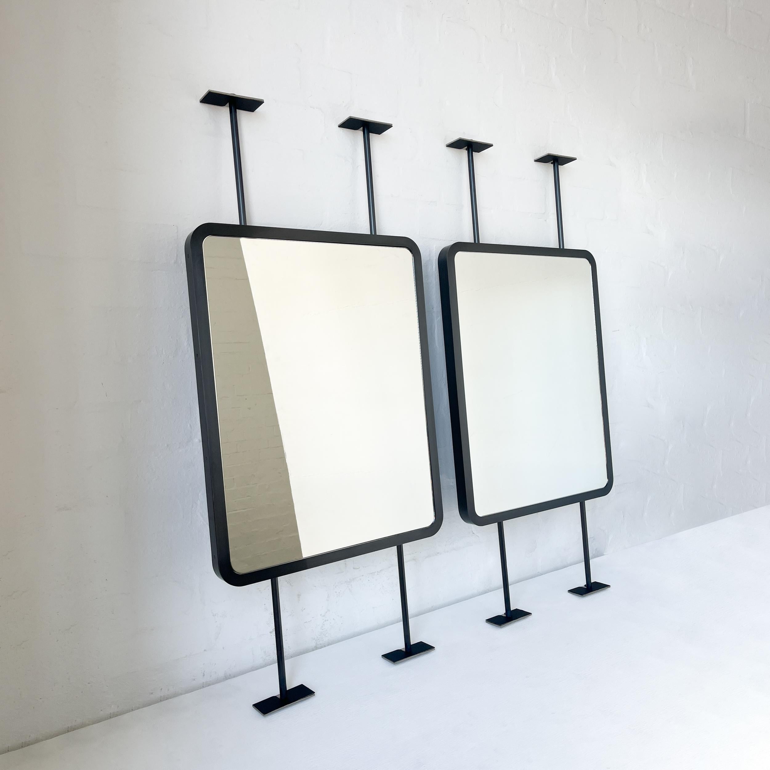 Set of two contemporary countertop to ceiling attached Quadris™ rectangular mirrors with a handcrafted blackened stainless steel full frame. Designed and made in London, UK. These mirrors are fully customisable.

Dimensions:

H 61cm x W 48.3cm x D