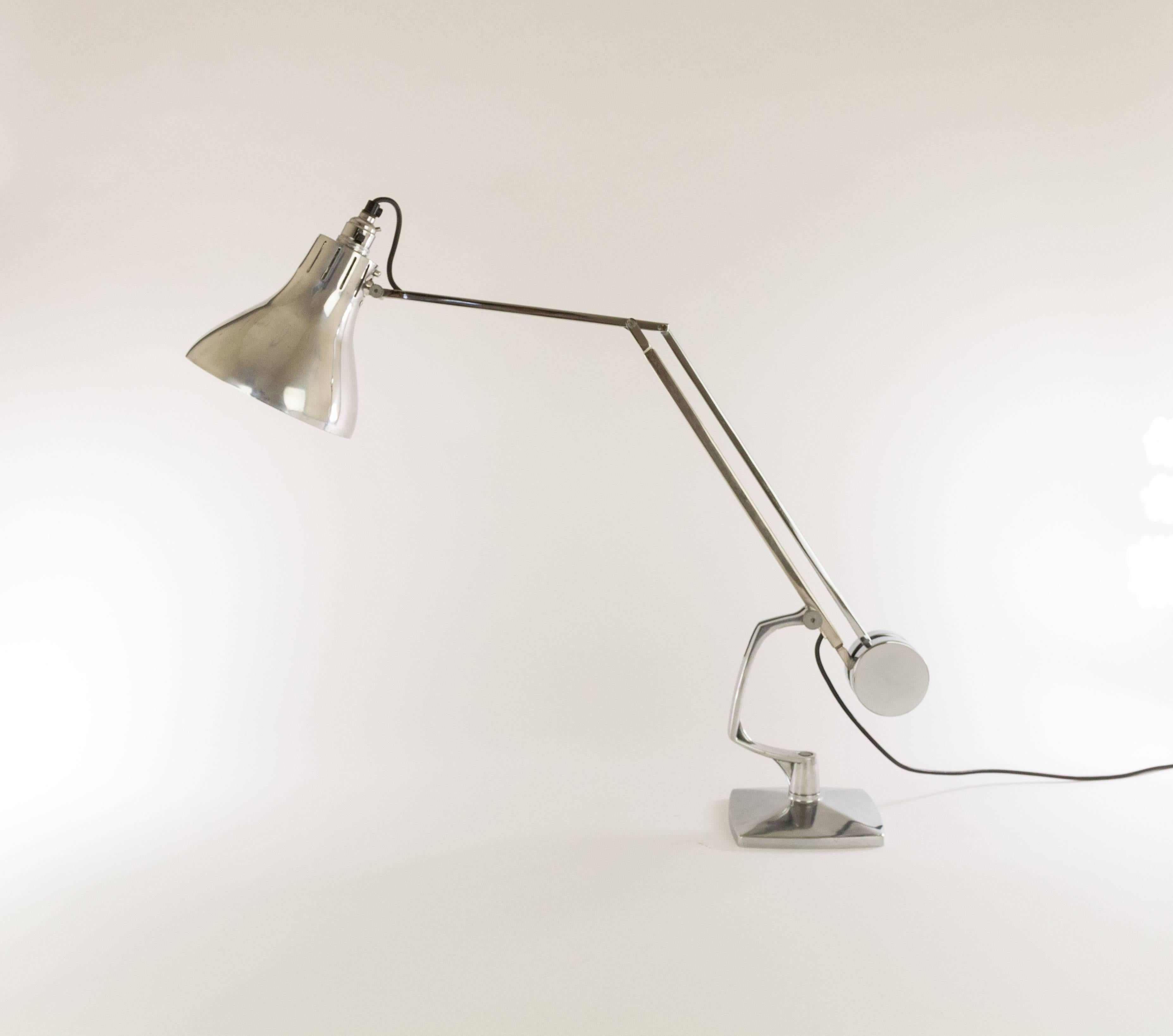 Adjustable desk lamp by, most probably, manufacturer Hadrill & Horstmann Ltd., England.

The light has a heavy base and a polished counterweight which gives the lamp an amazing reach and allows it to be angled in all possible directions.

There are