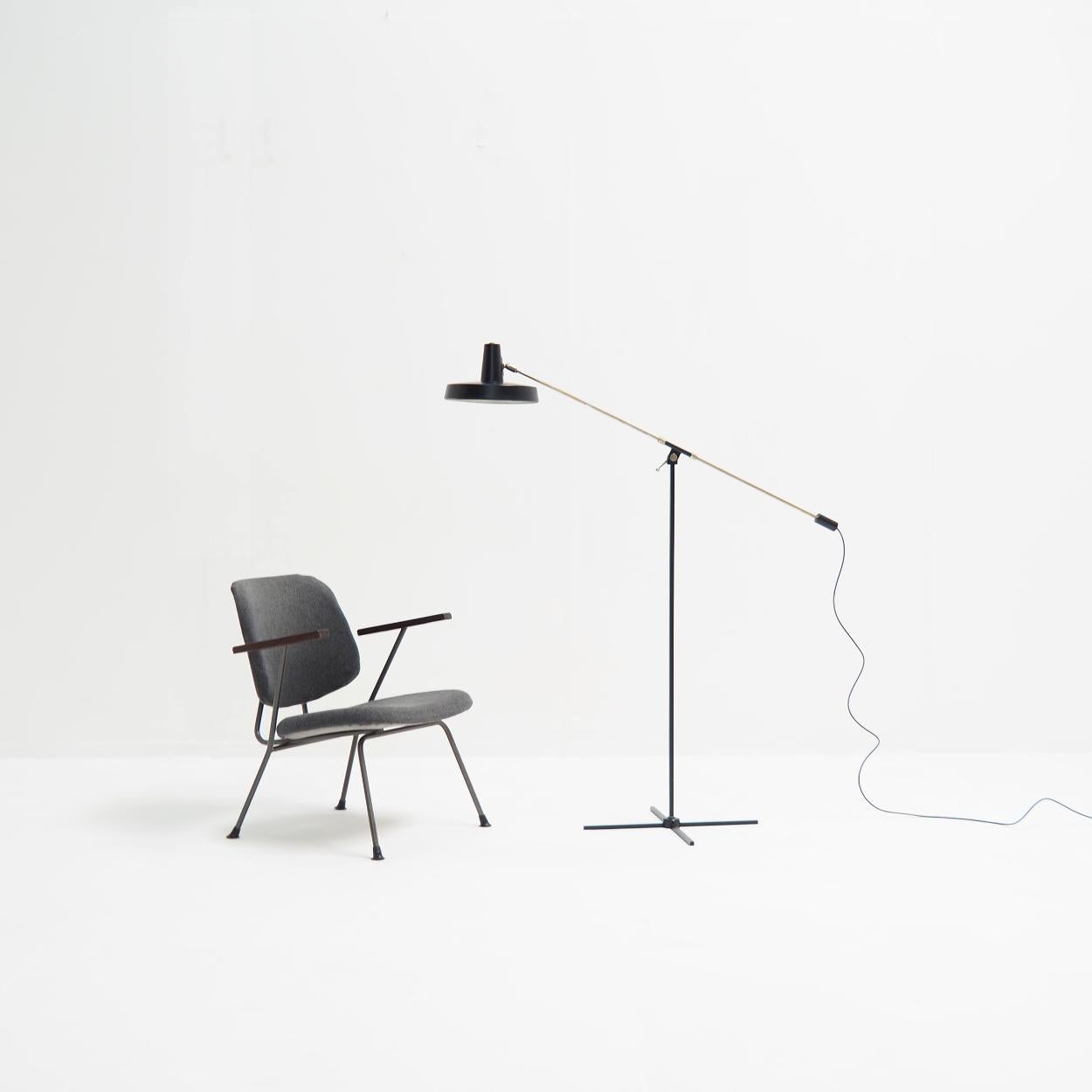 Floor lamp from the 1960s/70s produced by the Belgian company Boulanger.

The lamp is made of black painted metal with an adjustable chrome metal rod. The shade is also adjustable. It can be positioned in many ways.

The lamp has been rewired and