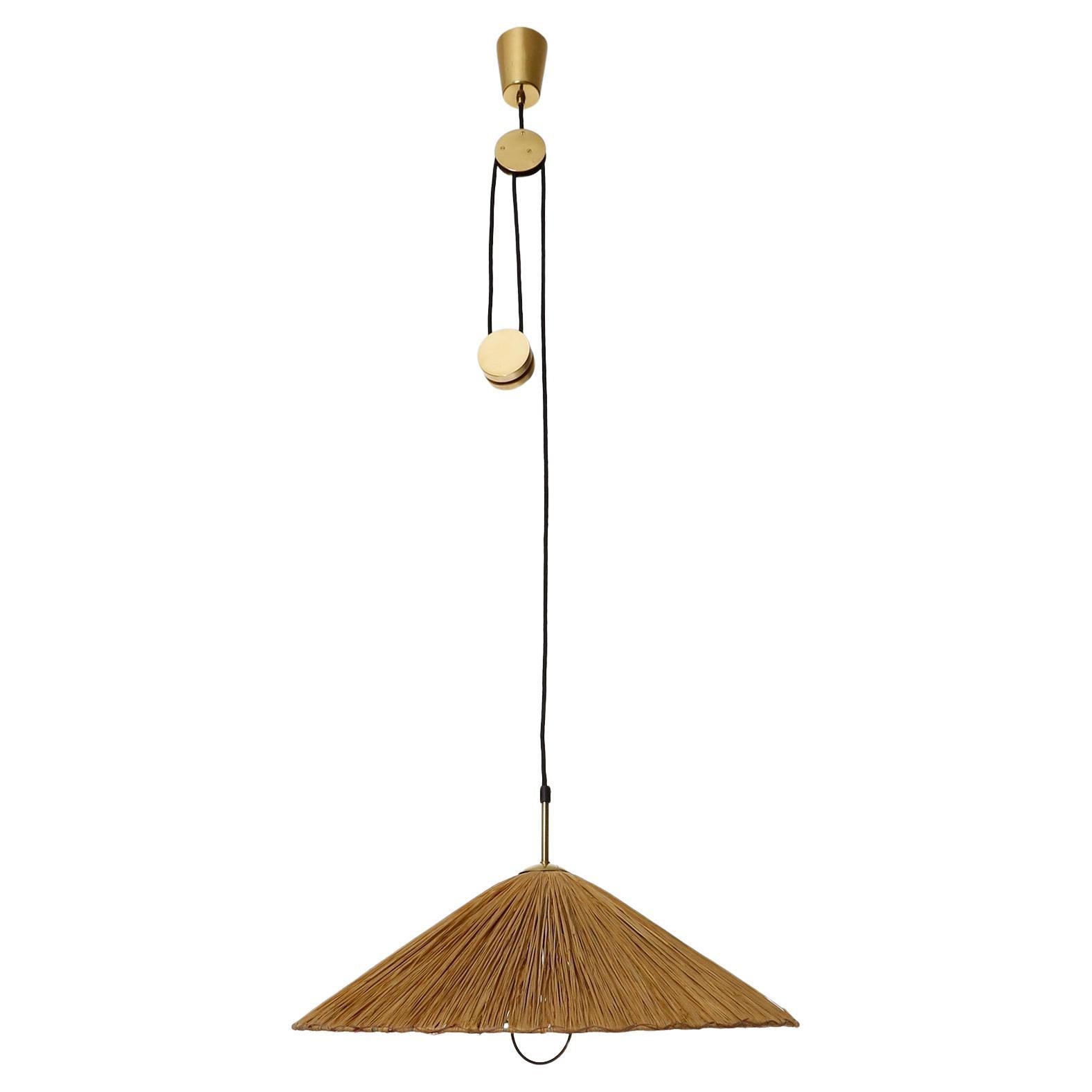 A rare and fantastic height adjustable brass counter balance pendant lamp with a straw lampshade model 'Jo-Jo Zug' no. 2505 by J.T. Kalmar manufactured in midcentury in 1950s.
The light is based on a design by Josef Frank from the 1930s. In the