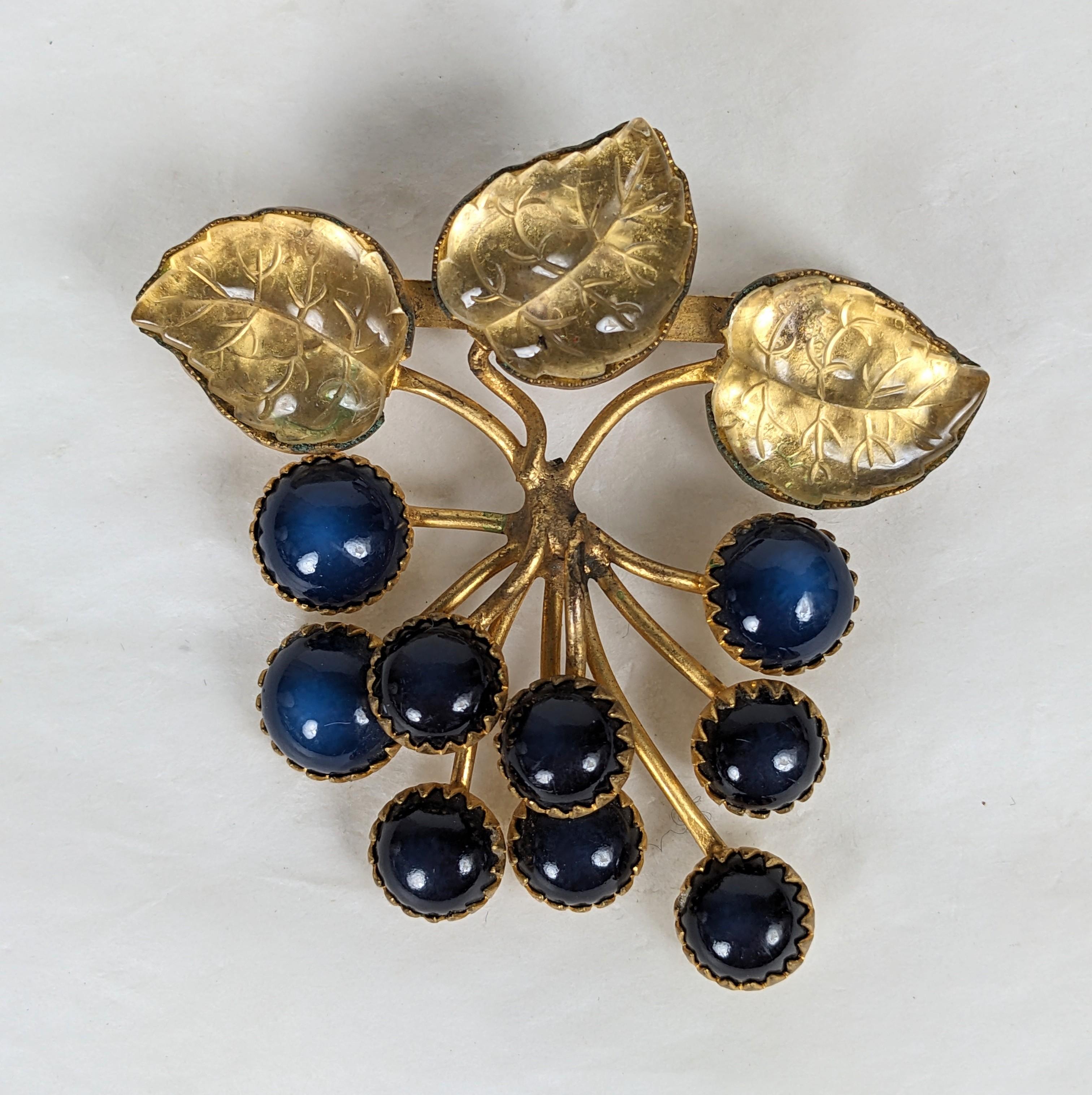 Rare Countess Cis Berry Brooch from the 1960's. Designed with a deep blue glass berries with molded citrine glass leaves set into gilt bronze filigree settings. Unsigned but recognized as a Countess Cis design. French closure. 1960's France. 2.25